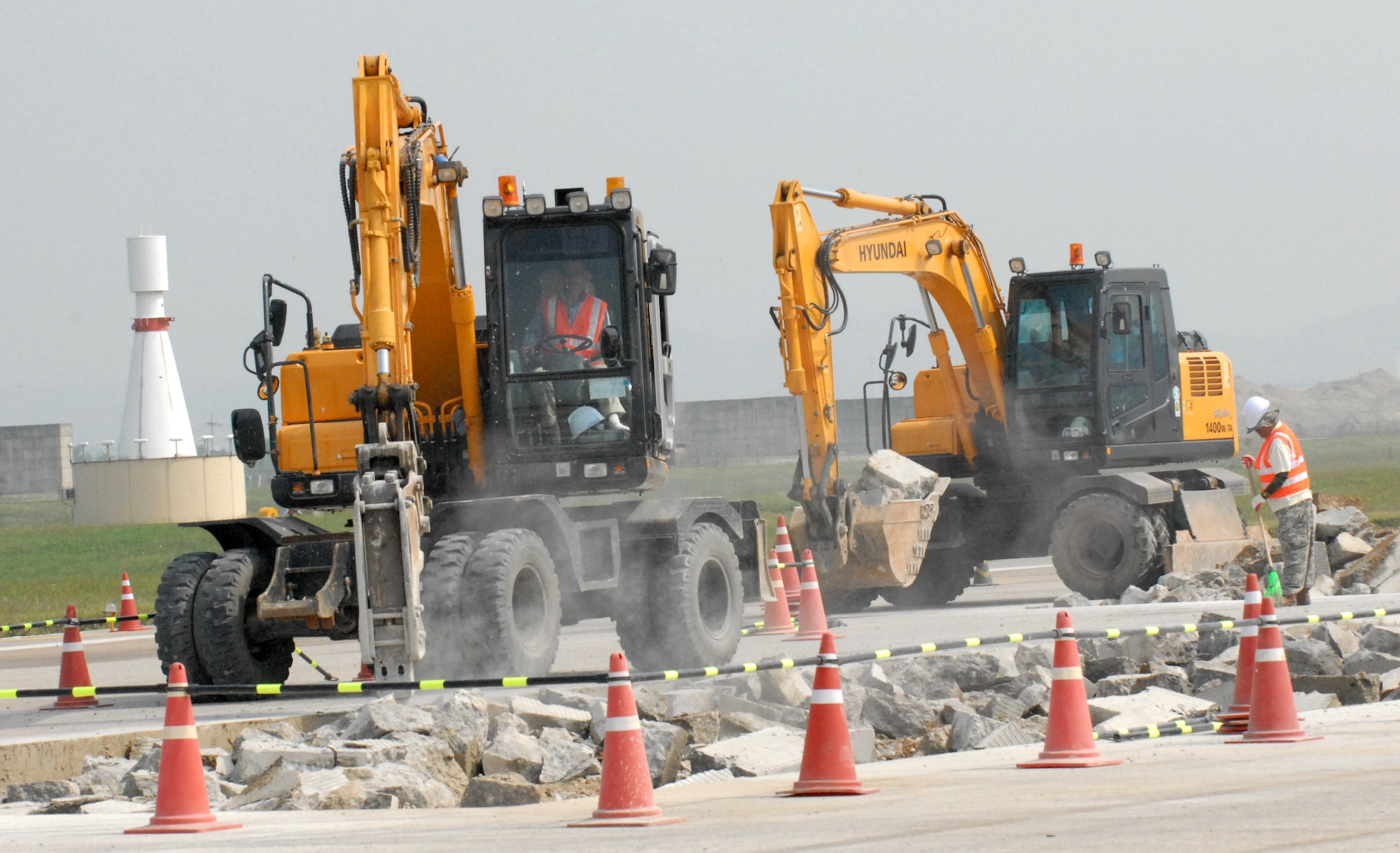 Contracted personnel from the Republic of Korea repair a large piece of the Osan Air Base flightline Sept. 17. The runway is scheduled to be closed for two weeks for major repairs. (U.S. Air Force photo by 1st Lt. Chris Hoyler)
