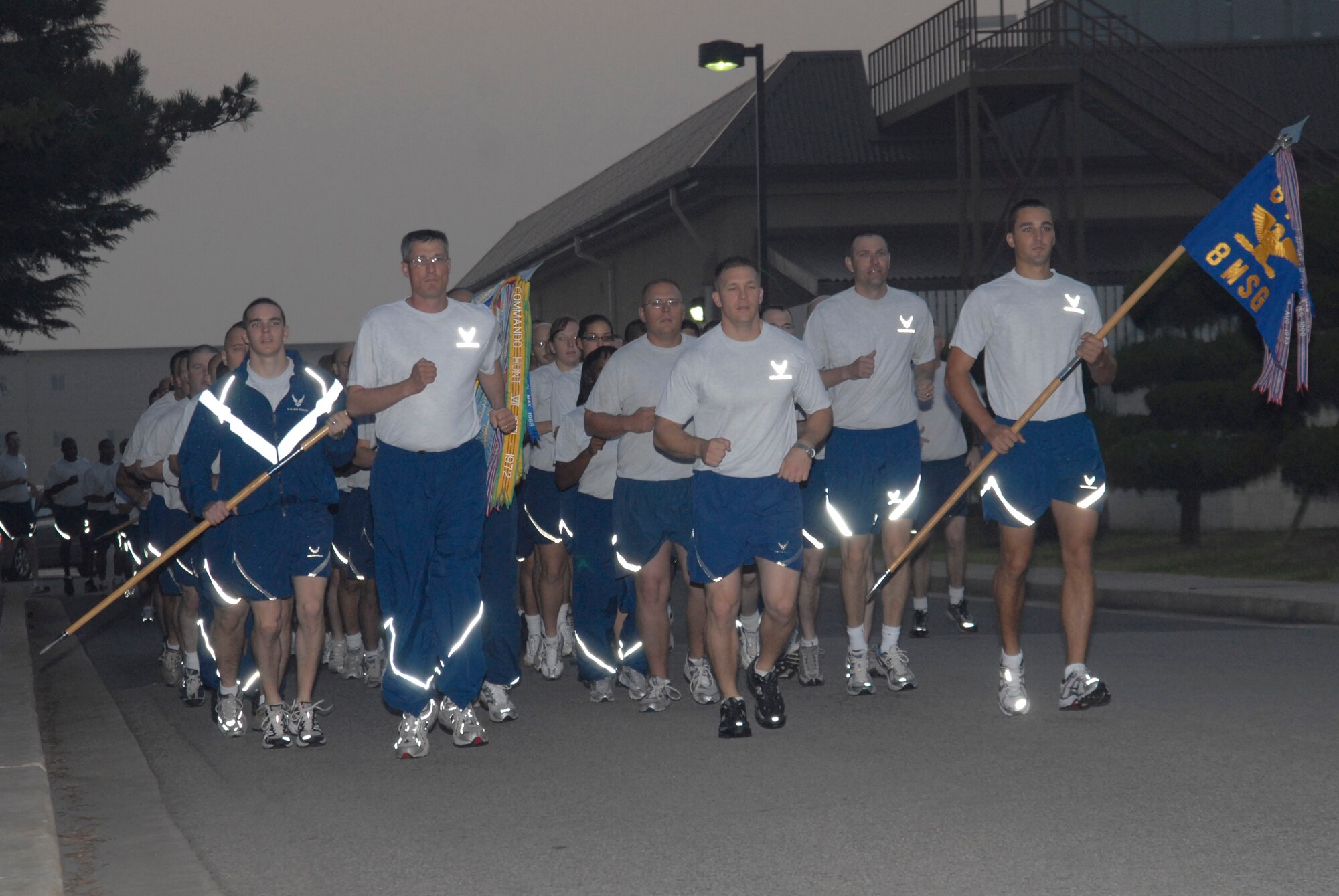 KUNSAN AIR BASE, Republic of Korea -- Col. Patrick Clements, 8th Mission Support Group commander, runs with the lead formation during the beginning of the 8th MSG fun run Sept 18. This 2.3 mile run included every squadron within the MSG running in formation in recognition of the Air Force Birthday. (U.S. Air Force photo/Staff Sgt. Darnell T. Cannady)