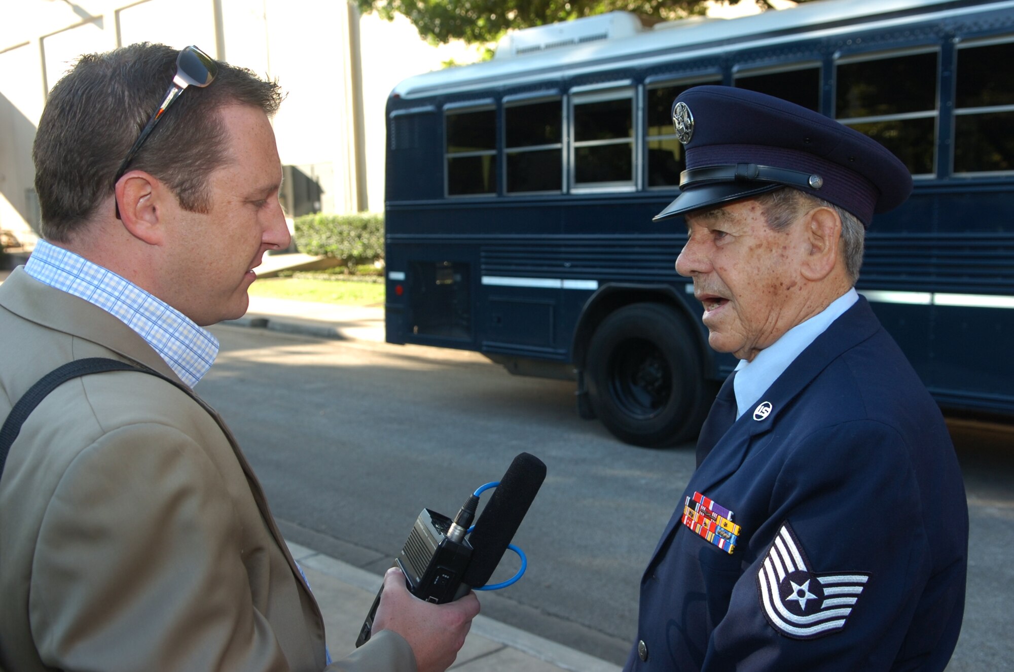 Ex-POW and retired Tech. Sgt. Joseph Alexander, answers questions from a WOAI Newsradio reporter following the Air Force Intelligence, Surveillance and Reconnaissance Agency POW/MIA Remembrance Ceremony Sept. 17 at Lackland Air Force Base, Texas. Sergeant Alexander holds the distinction of being the youngest POW during WWII. The former B-17 bomb loader was captured at 15 and released two days after turning 19. (Photo by William Belcher)
