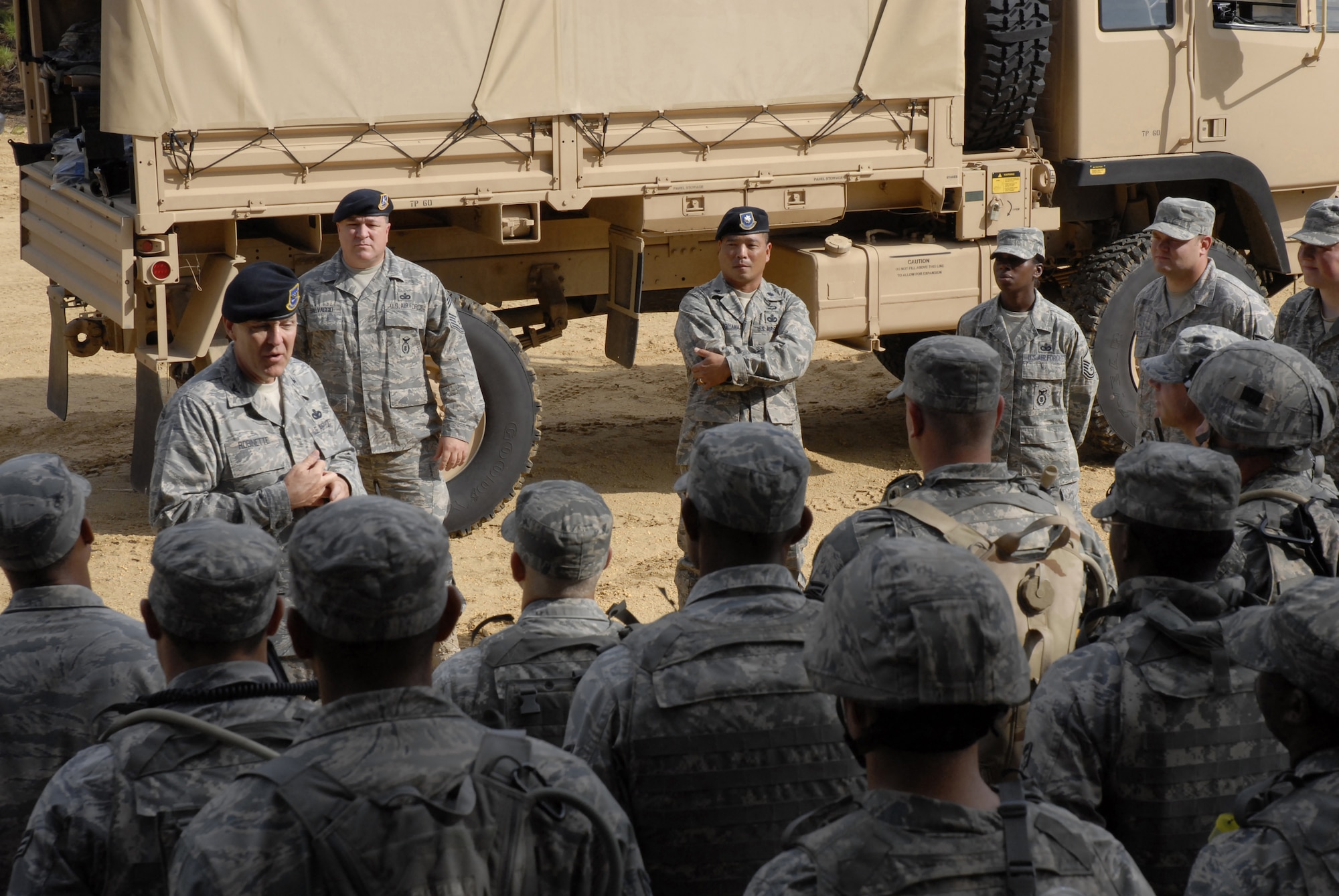 Commander of the Headquarters Air Force Security Forces Center, Colonel Steven Robinette, visits with security forces students attending pre-deployment training conducted by the 421st Combat Training Squadron at the U.S. Air Force Expeditionary Center, Joint Base McGuire-Dix-Lakehurst, N.J., September 15, 2009 on a Fort Dix range. (U.S. Air Force Photo/Tech. Sgt. Paul R. Evans)