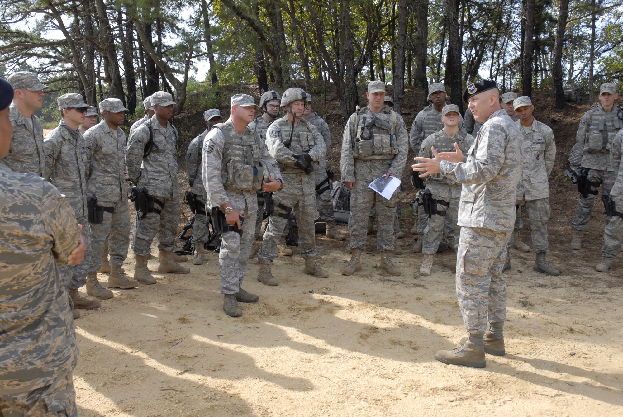 Commander of the Headquarters Air Force Security Forces Center, Colonel Steven Robinette, visits with security forces students attending pre-deployment training conducted by the 421st Combat Training Squadron at the U.S. Air Force Expeditionary Center, Joint Base McGuire-Dix-Lakehurst, N.J., September 15, 2009 on a Fort Dix range.  (U.S. Air Force Photo/Tech. Sgt. Paul R. Evans)