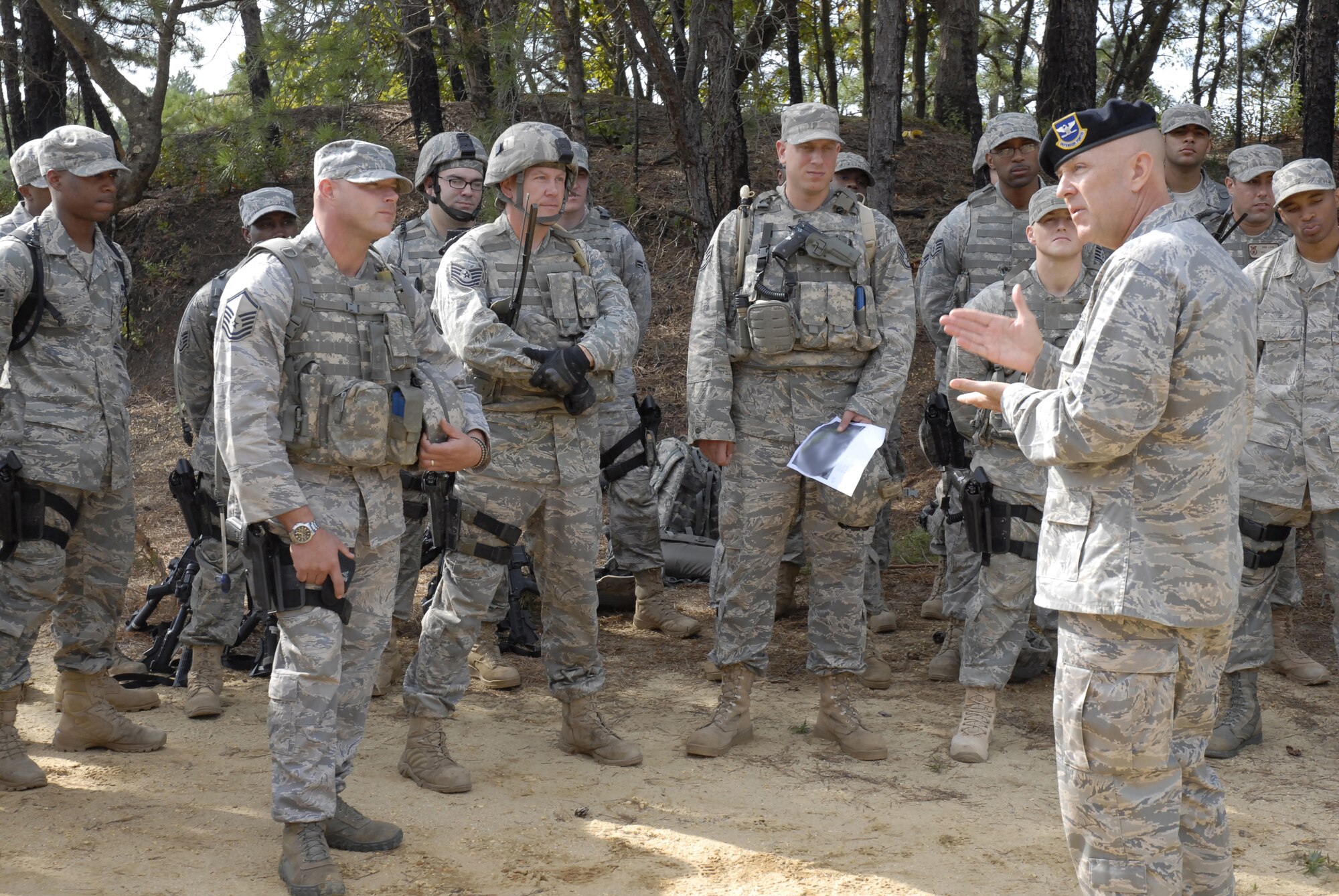 Commander of the Headquarters Air Force Security Forces Center, Colonel Steven Robinette, visits with security forces students attending pre-deployment training conducted by the 421st Combat Training Squadron at the U.S. Air Force Expeditionary Center, Joint Base McGuire-Dix-Lakehurst, N.J., September 15, 2009 on a Fort Dix range.  (U.S. Air Force Photo/Tech. Sgt. Paul R. Evans)