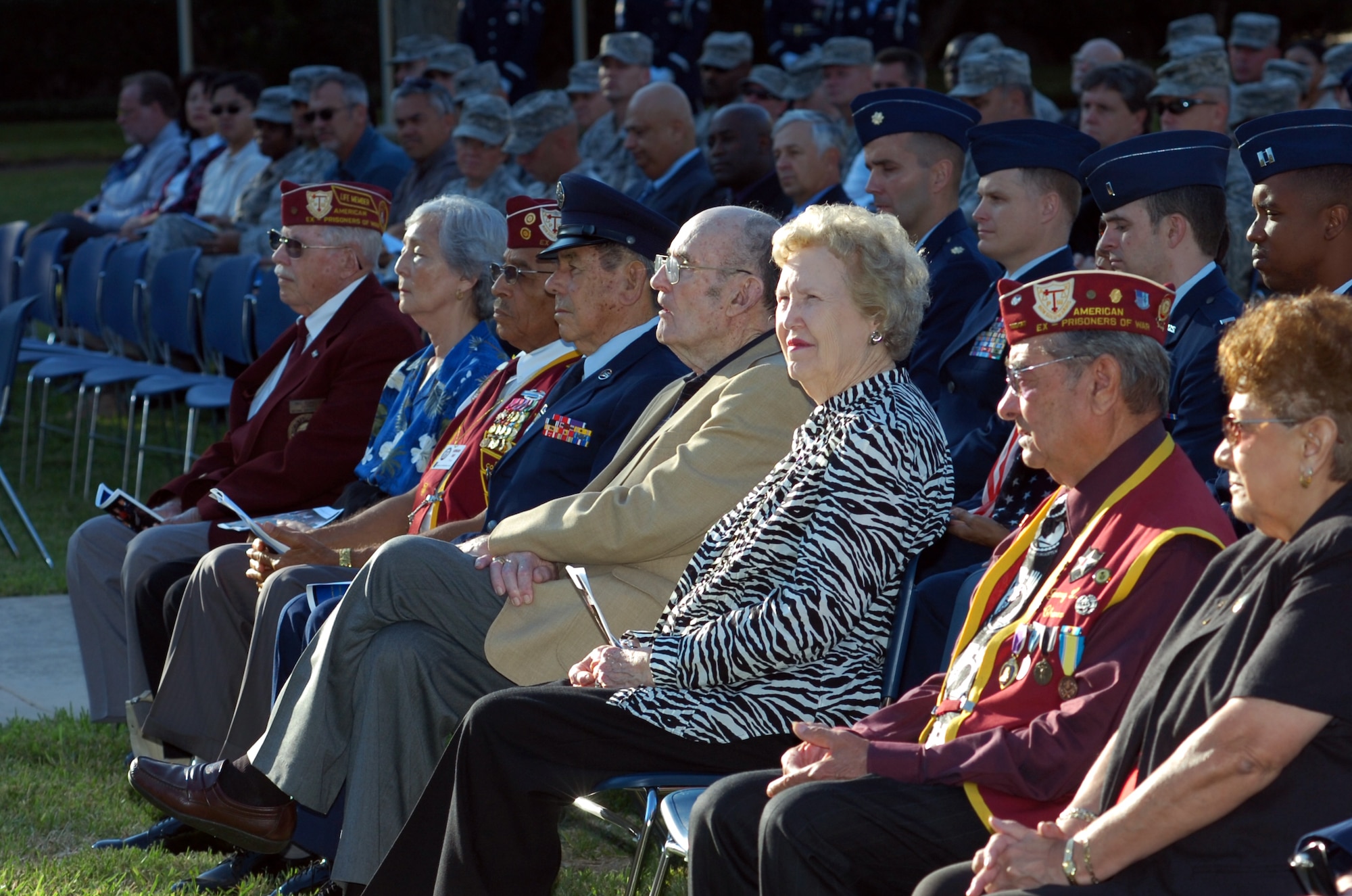 Five ex-POWs and spouses listen to remarks during the Air Force Intelligence, Surveillance and Reconnaissance Agency POW/MIA Remembrance Ceremony Sept. 17 at Lackland Air Force Base, Texas. In addition to recognizing the honorees, the annual Agency observance paid tribute to fallen comrades from the service branches. (Photo by William Belcher)     