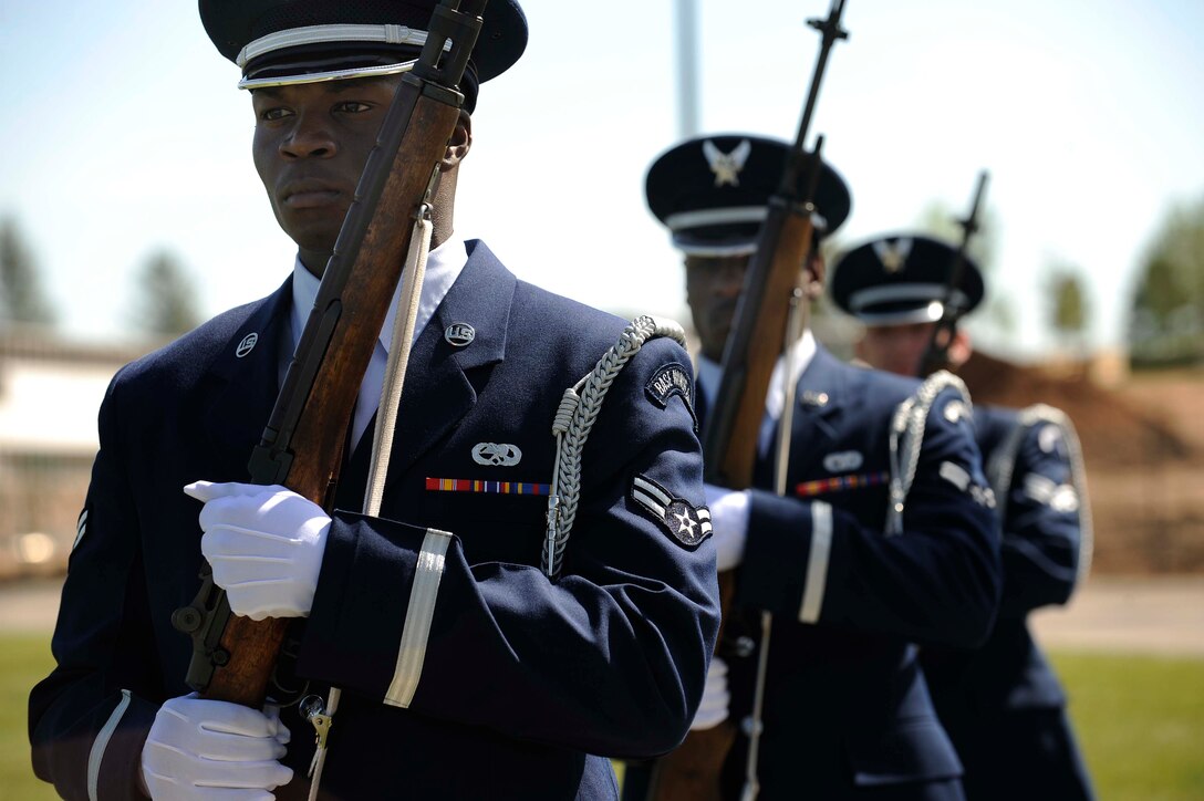 (Left to Right) Airman 1st Class Royce Sims, Airman 1st Class Brandon Bussey and Senior Airman David Bailey, Ellsworth Air Force Base Honor Guard members, prepare to conduct a 21-gun salute for a funeral service held at Black Hills National Cemetery in Rapid City, S.D., Sept. 15. The service was held for a World War ll veteran. (U.S. Air Force photo by Airman 1st Class Corey Hook)