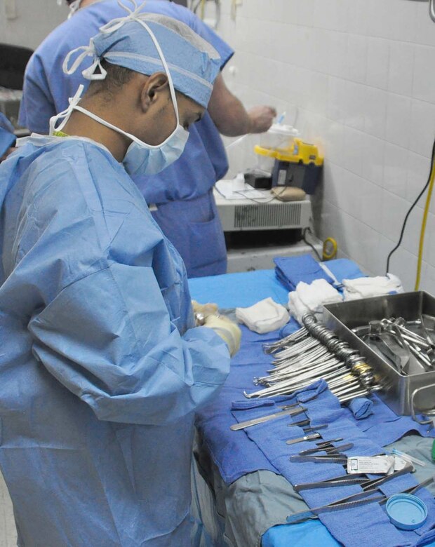 SOTO CANO AIR BASE, Honduras — Air Force Staff Sgt. Isaac Bermudez, JTF-Bravo, Medical Element surgical technician, prepares surgical instruments for an operation in a local hospital Sept. 16 in Comayagua, Honduras. Sergeant Bermudez is part of a four-person team that goes to La Paz and Comayagua hospitals Tuesdays, Wednesdays and Thursdays to perform surgeries and lessen the burden on local doctors during medical readiness training exercises, or MEDRETE (U.S. Air Force photo/Staff Sgt. Chad Thompson).