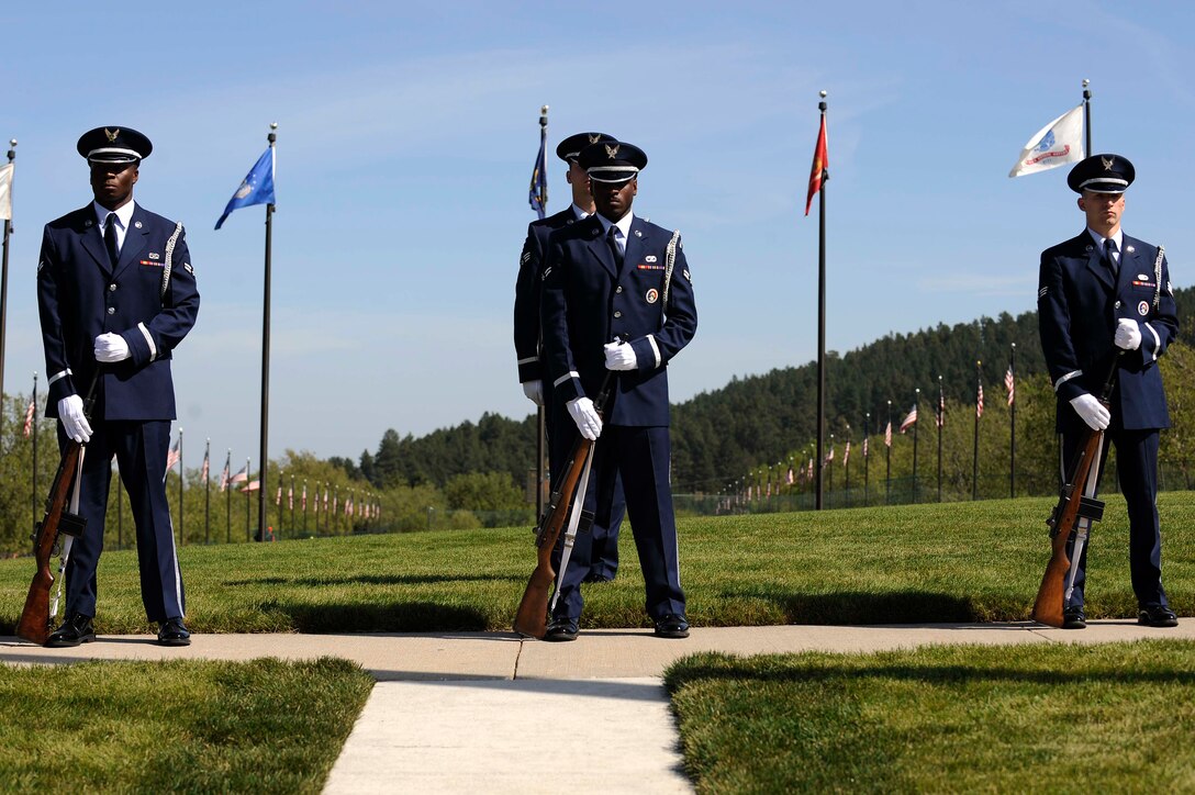 Airmen from Ellsworth Air Force Base Honor Guard prepare to conduct a 21-gun salute for a funeral service held at Black Hills National Cemetery in Rapid City, S.D., Sept. 15. The service was held for a World War ll veteran. (U.S. Air Force photo by Airman 1st Class Corey Hook)