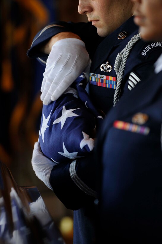 Staff. Sgt. Michael Risse, 28th Honor Guard NCO-in-charge, completes the flag folding portion during a funeral at Black Hills National Cemetery in Rapid City, S.D., Sept. 15. The honor guard paid tribute to a former military member who served in World War ll. (U.S. Air Force photo by Airman 1st Class Corey Hook)