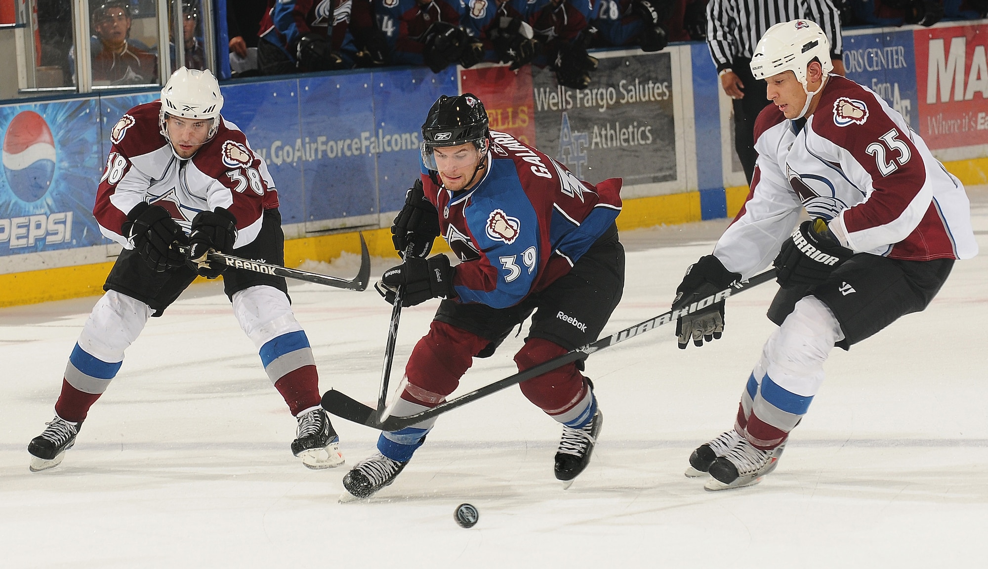 Colorado Avalanche forward TJ Galiardi weaves between defenders Codey Burki and Chris Stewart during the Avs' Burgundy and White Game at the U.S. Air Force Academy's Cadet Ice Arena Sept. 16, 2009. The White team defeated the Burgundy team 3-2 on a shootout goal by Paul Stastny. (U.S. Air Force photo/Rachel Boettcher)