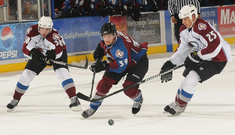 Colorado Avalanche forward TJ Galiardi weaves between defenders Codey Burki and Chris Stewart during the Avs' Burgundy and White Game at the U.S. Air Force Academy's Cadet Ice Arena Sept. 16, 2009. The White team defeated the Burgundy team 3-2 on a shootout goal by Paul Stastny. (U.S. Air Force photo/Rachel Boettcher)