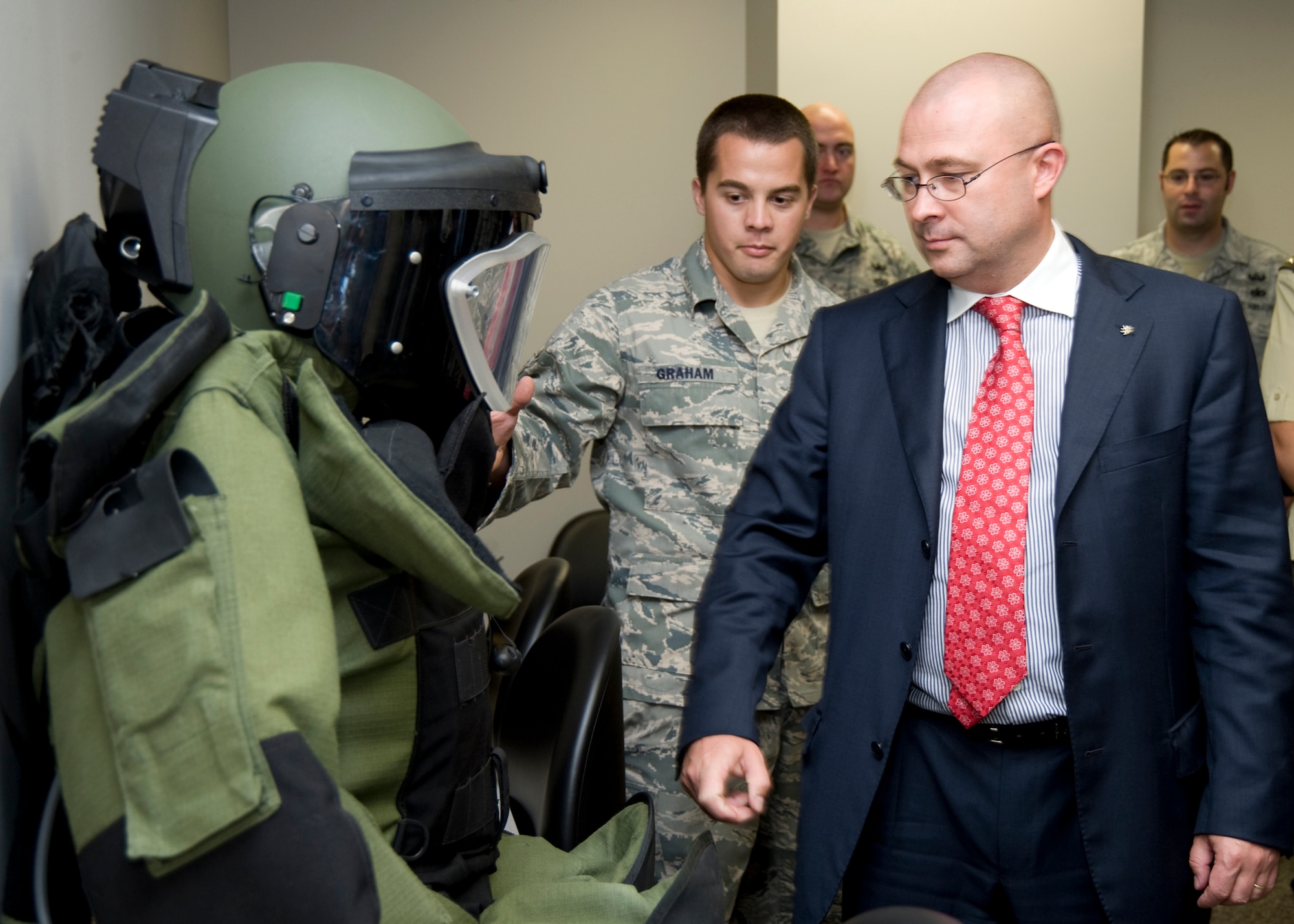 Airman 1st Class Nicholas Graham, 96th Civil Engineer Squadron, briefs Deputy Prime Minister Martin Barták from the Czech Republic on the explosive ordinance disposal protective suit. The Deputy Prime Minister also serves as the Minister of Defense for the Czech nation and visited the U.S. to meet with Secretary of Defense Robert Gates and other national level military leaders. Minister Barták visited Eglin EOD in an effort to learn more about this multi-effort mission. (U.S. Air Force photo/ Debbie Haussermann.)