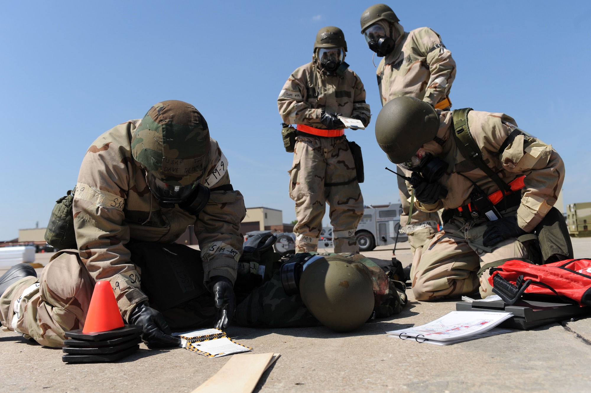 WHITEMAN AIR FORCE BASE, Mo. – Members of the 442nd Fighter Wing initiate self-aid and buddy care procedures after finding one of their own simulated wounded during the Phase II exercise, Sept. 16. Phase II exercise is an annual mobility exercise, which inspects all areas of 442nd operations. (U.S. Air Force photo/Senior Airman Cory Todd)