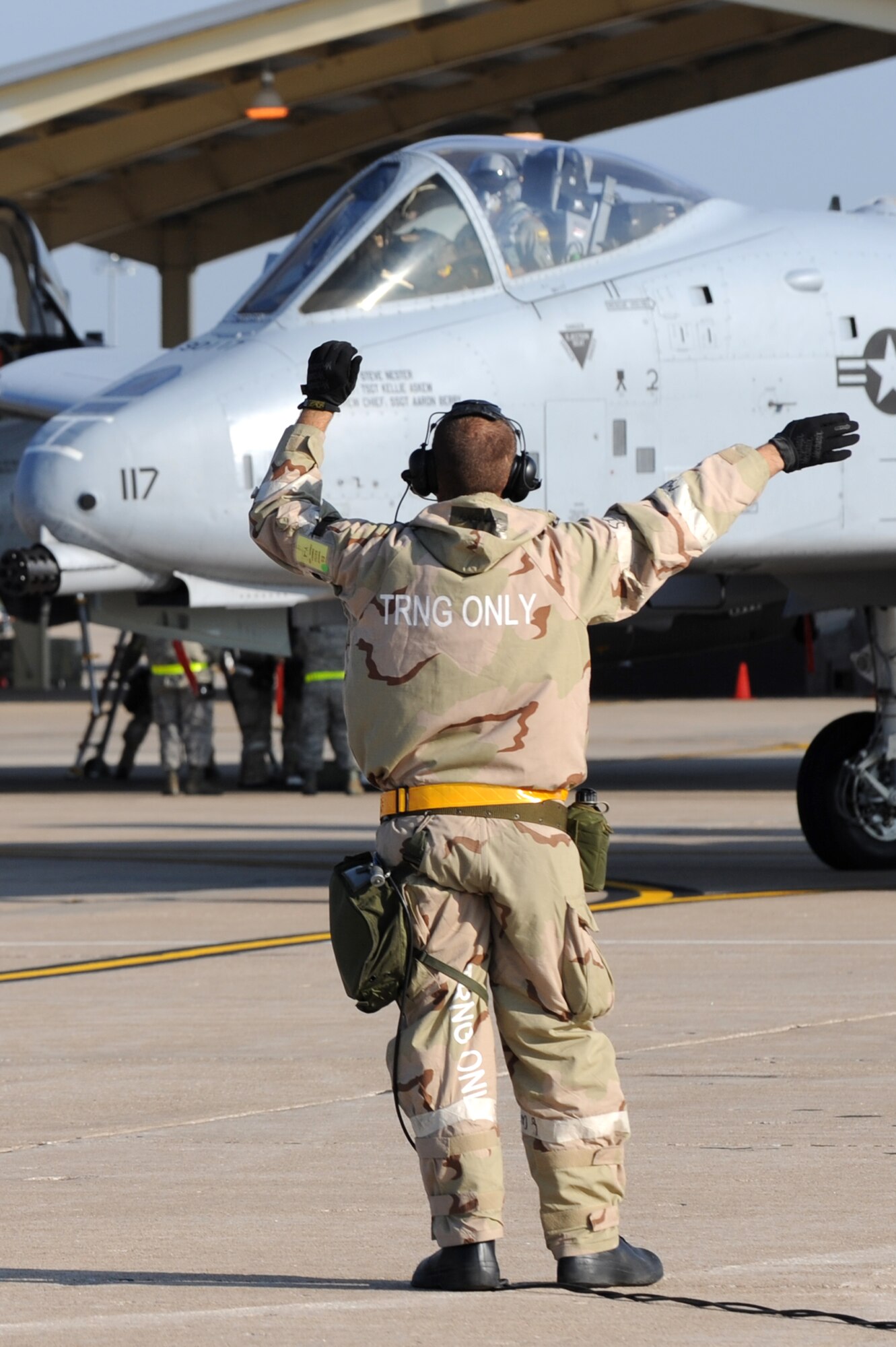 WHITEMAN AIR FORCE BASE, Mo. – A crew chief for the 442nd Fighter Wing signals the pilot of an A-10 Thunderbolt II which way he needs to turn during the Phase II exercise, Sept. 16. The Phase II exercise is an annual mobility exercise, which inspects all areas of 442nd operations. (U.S. Air Force Photo/ SrA Cory Todd)