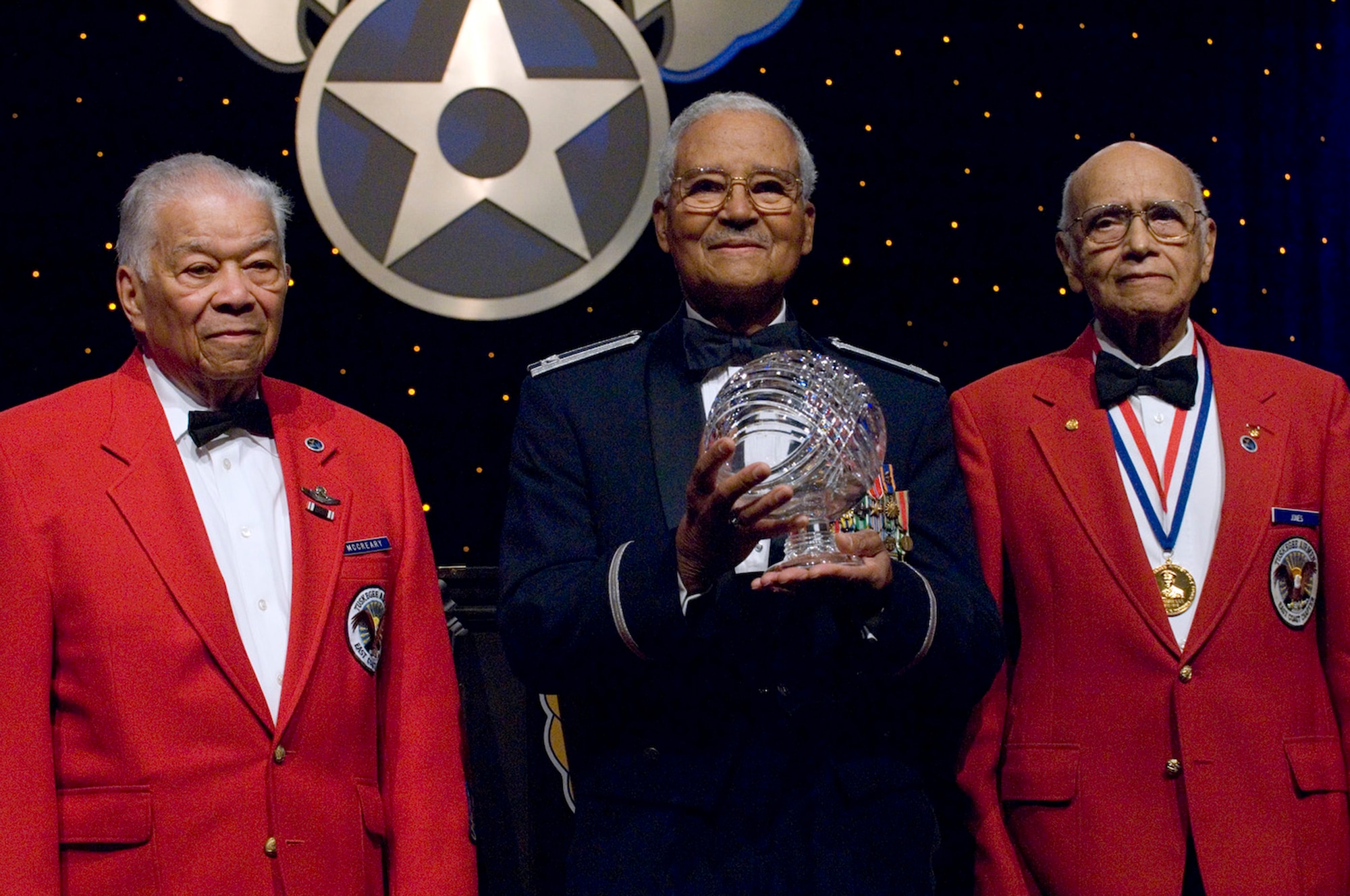 Retired Lt. Col. Walter McCreary, retired Col. Charles McGee and retired Col. Elmer Jones hold the Lifetime Achievement Award Sept. 16, 2009, at the Air Force anniversary dinner held at the Gaylord National Hotel and Convention Center in National Harbor, Md. Colonels Jones, McGee and McCreary are members of the Tuskegee Airmen. The dinner was the end of the 2009 Air Force Association Air & Space Conference and Technology Exposition. (U.S. Air Force photo/Staff Sgt. Desiree N. Palacios)
