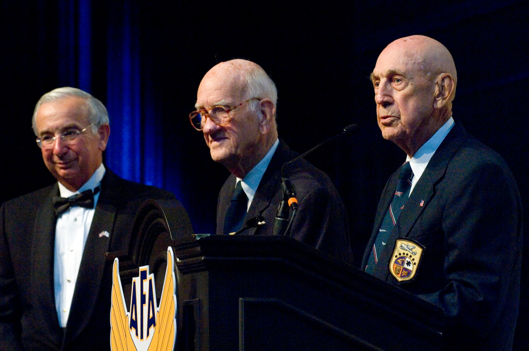 Joseph Sutter presents retired Maj. Thomas Griffin and retired Lt. Col. Richard Cole the Lifetime Achievement Award at the Air Force anniversary dinner Sept. 16, 2009, at the Gaylord National Hotel and Convention Center in National Harbor, Md. Major Griffin and Colonel Cole are members of the Doolittle Raiders. Mr. Sutter is the Air Force Association chairman of the board. The dinner was the end of the 2009 Air Force Association Air & Space Conference and Technology Exposition. (U.S. Air Force photo/Staff Sgt. Desiree N. Palacios) 
