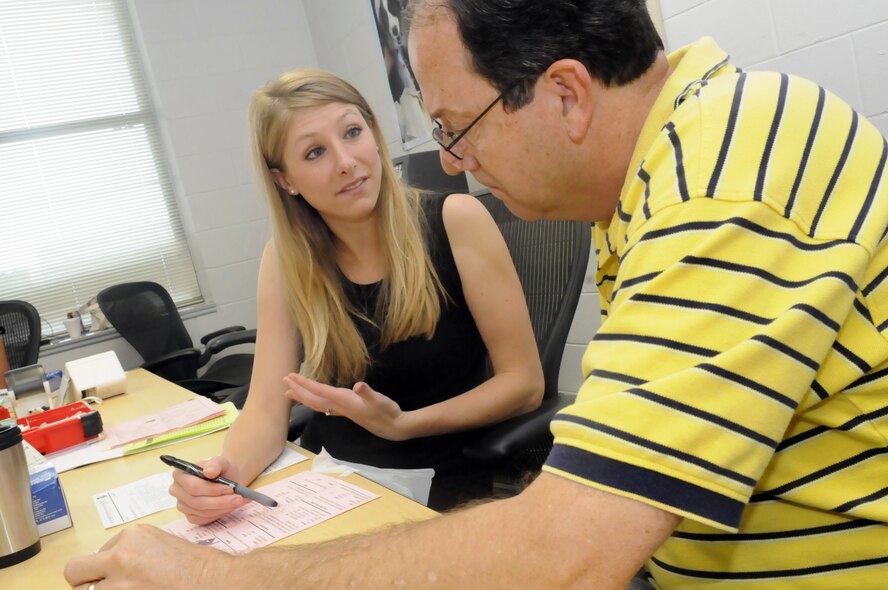 Dani Lebovitz, registered and licensed dietitian, counsels Joe Trussell about some of his test results during a screening . (U. S. Air Force photo by Sue Sapp)
