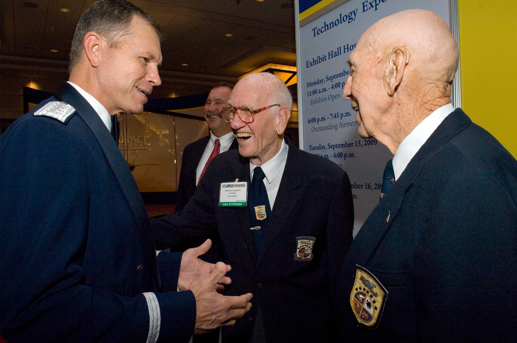 Gen. William M. Fraser III speaks to retired Maj. Thomas Griffin and retired Lt. Col. Richard Cole at the Air Force anniversary dinner Sept. 16, 2009, at the Gaylord National Hotel and Convention Center in National Harbor, Md. General Fraser is the commander of Air Combat Command, and Major Griffin and Colonel Cole are members of the Doolittle Raiders. The dinner was the end of the 2009 Air Force Association Air & Space Conference and Technology Exposition. (U.S. Air Force photo/Staff Sgt. Desiree N. Palacios) 