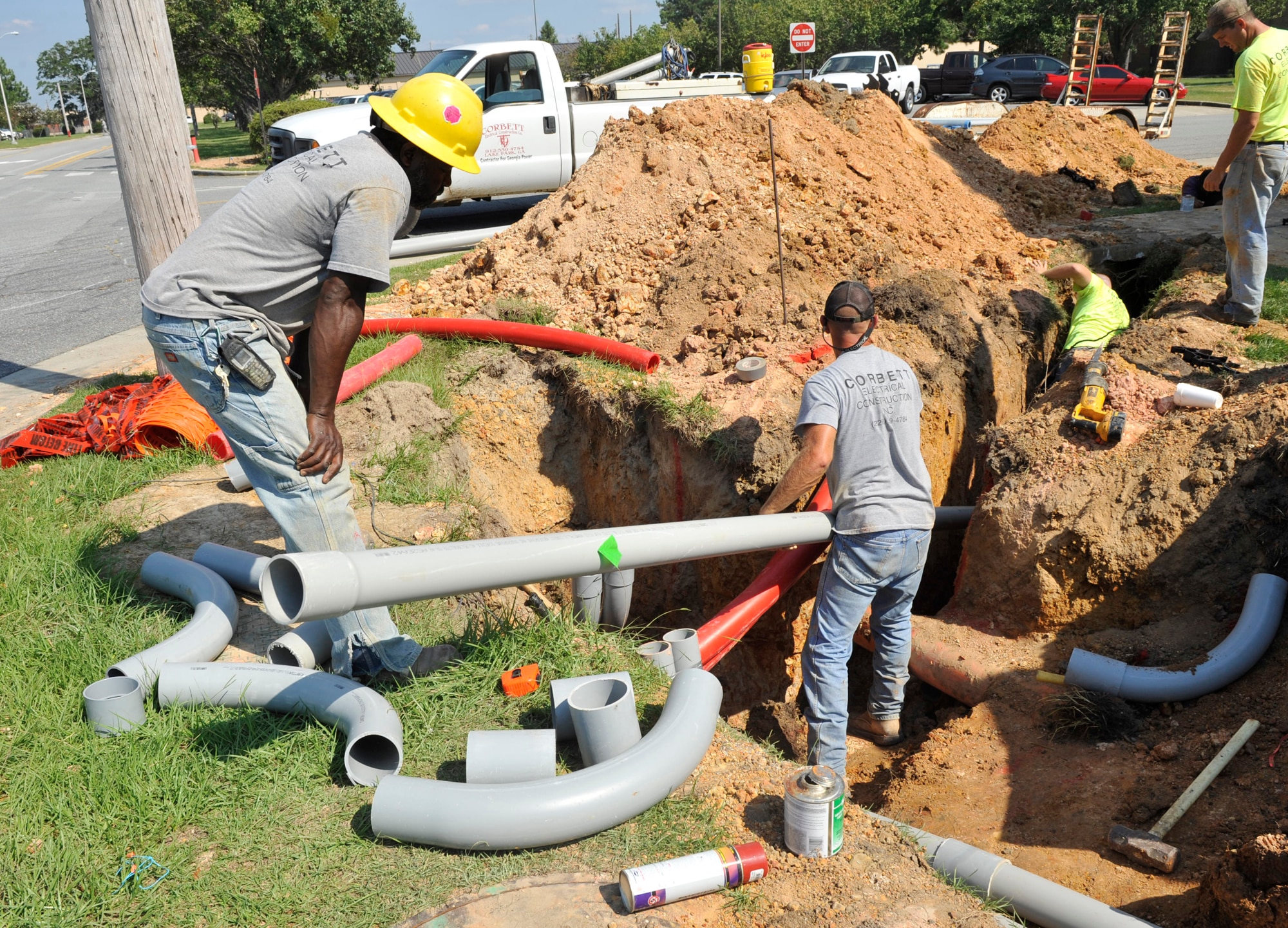 MOODY AIR FORCE BASE, Ga. -- Contract workers participate in a construction project to install underground electrical duct lines around Moody here Sept. 9. The purpose of the project is to transition the overhead power lines to underground power lines throughout the base. (U.S. Air Force photo by Senior Airman Schelli Jones) 