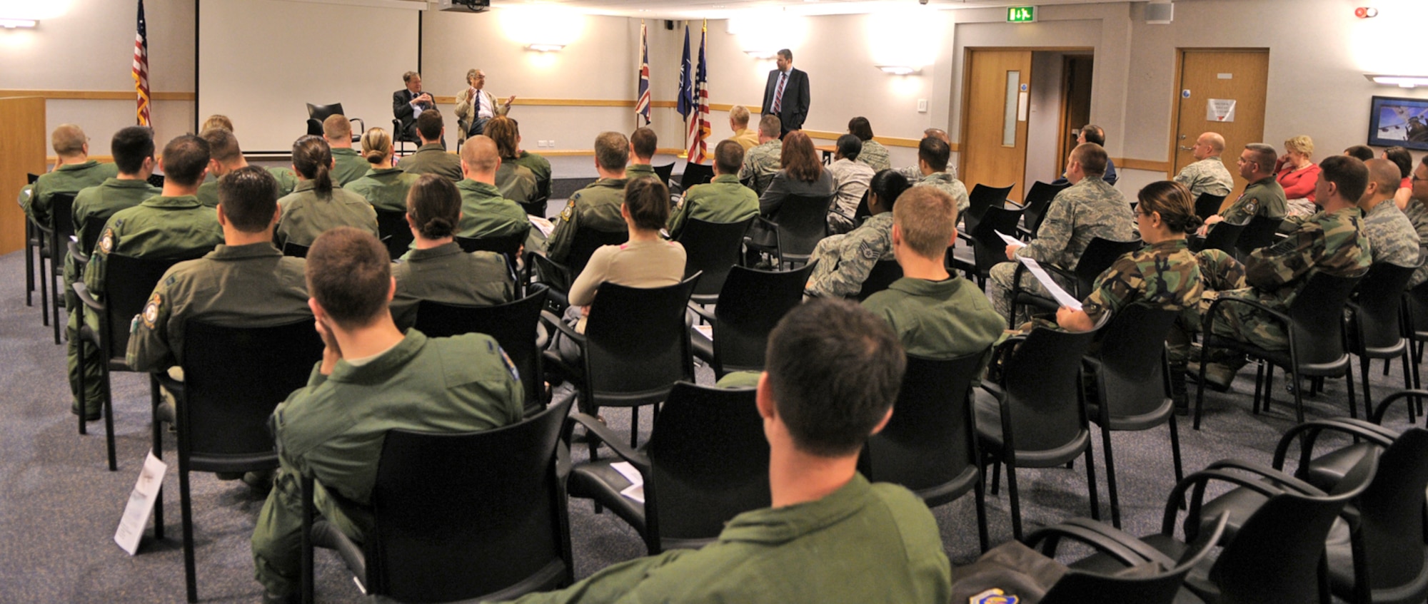 A crowd of about 50 Airmen at Royal Air Force Mildenhall, England listen as two former Royal Air Force airmen recount their experiences as POWs in WWII Sept. 19, 2009. The pair were both interred at Stalug Luft III, the German POW camp featured in the movie, "The Great Escape." They visited the base to speak as part of RAF Mildenhall's POW/MIA Remembrance Week. (U.S. Air Force photo/Staff Sgt. Austin M. May) 