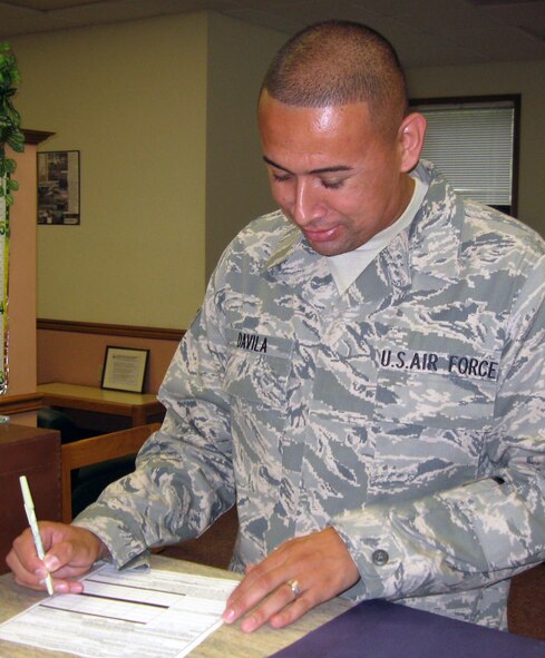 Senior Airman Harvi Davila, 4th Force Support Squadron Military Personnel Flight customer support counselor, reviews a Servicemembers’ Group Life Insurance form. The form allows servicemembers to elect receives their SGLI benefits in the event of their death. There is no limit to the number of beneficiaries or who they are. (U.S. Air Force photo by Tech. Sgt. Tammie Moore)