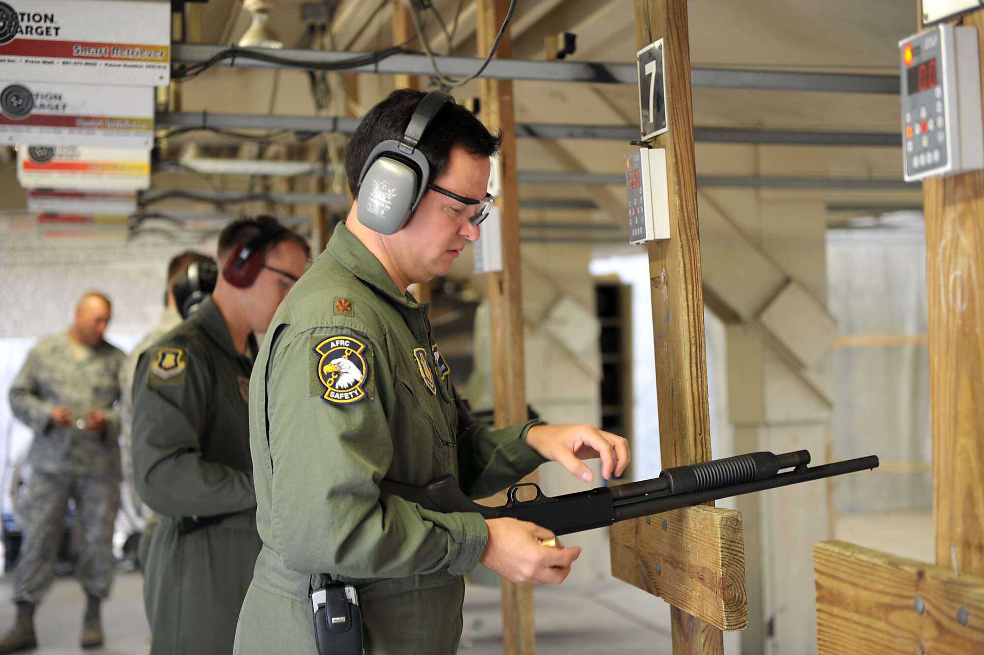 Maj. Travis Clark loads ammunition into a shotgun he fired during a weapons qualification course for flight safety officers at McConnell Air Force Base, Kan., on Sept. 16. Major Clark, the Reserve safety chief for the 931st Air Refueling Group, attended the course with safety officers assigned to the 22nd Air Refueling Wing, the 931st's active-duty host unit at McConnell. (U.S. Air Force photo/Tech. Sgt. Jason Schaap)
