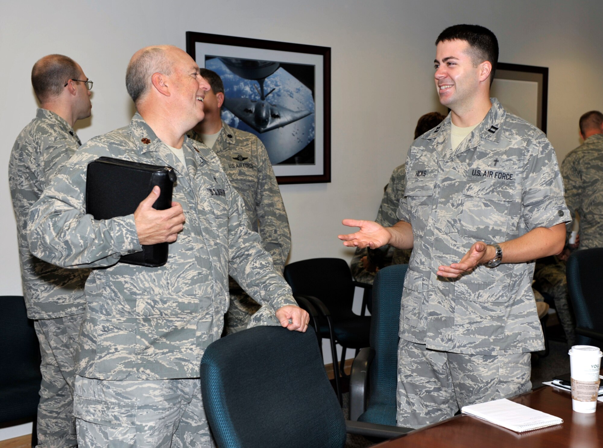 Two chaplains assigned to McConnell Air Force Base, Kan., Maj. Boyd Short and Capt. James Hicks (on right), talk during a total-force integration meet and greet at the base on Sept. 12. Reservists from the 931st Air Refueling Group and personnel from the 22nd Air Refueling Wing, the 931st's active-duty host unit at McConnell, who share the same jobs are looking for ways to better integrate their offices. Chaplain Short is assigned to the 22nd ARW and Chaplain Hicks is assigned to the 931st ARG. (U.S. Air Force photo/Tech. Sgt. Jason Schaap)    