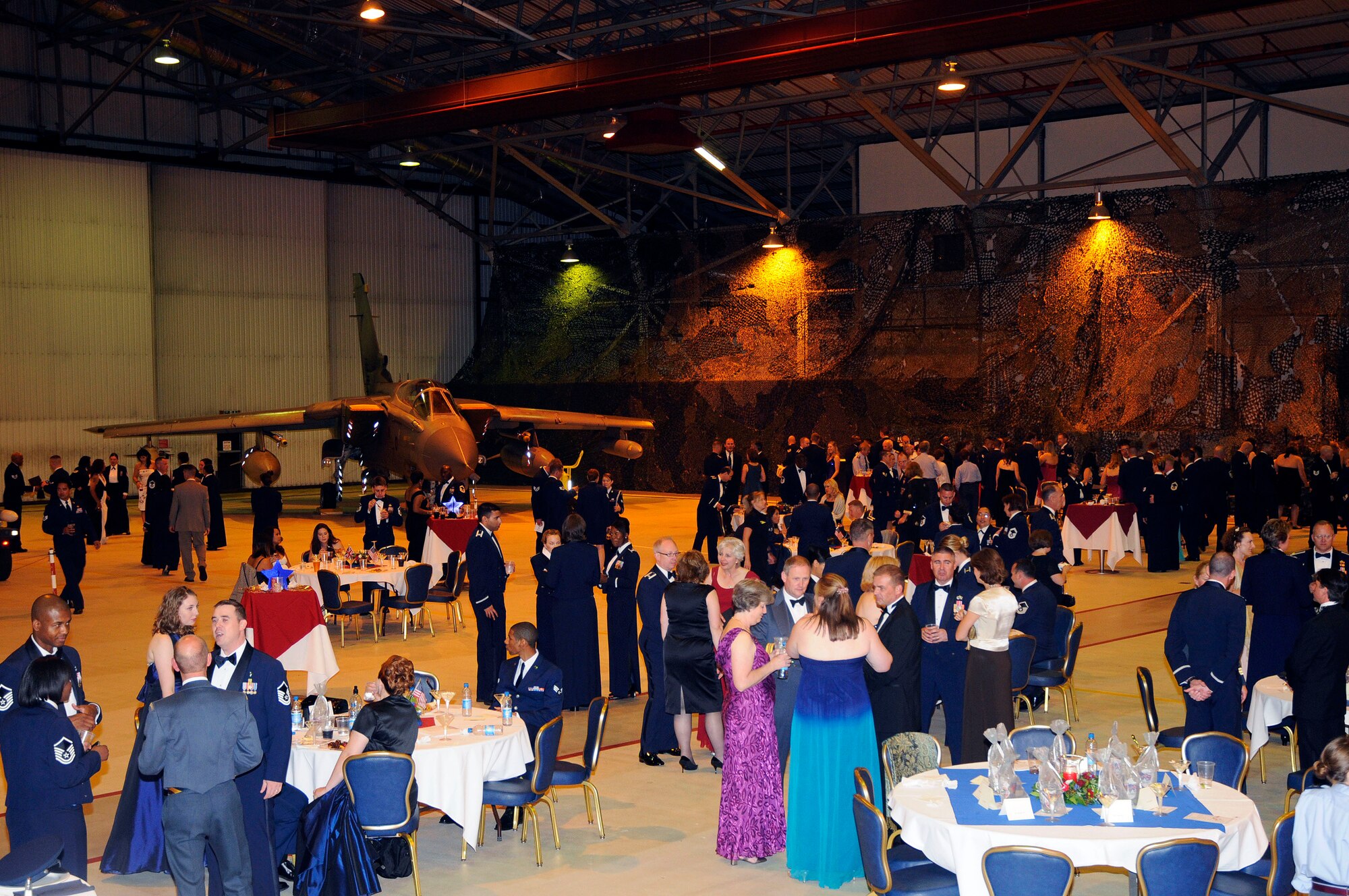 Military and civilian personnel socialize during the festivities at the Heritage Ball, Sep. 12, 2009, at RAF Lakenheath, England. The Heritage Ball celebrated 50 years of partnership between the RAF and the 48th Fighter Wing. (U.S. Air Force photo/Airman 1st Class Eboni Knox)