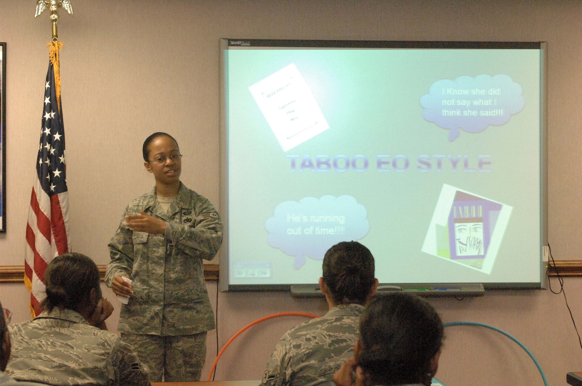Staff Sgt. Jennifer Holmes, 4th Fighter Wing Equal Opportunity Office, explains the rules of "Taboo: EO Style" to a group of Airmen completing the First Term Airmen Center program here at Seymour Johnson Air Force Base, N.C., Sept. 17, 2009. The EO staff uses innovative methods such as games and role playing to get their message across. (U.S. Air Force photo by Airman 1st Class Marissa Tucker)   