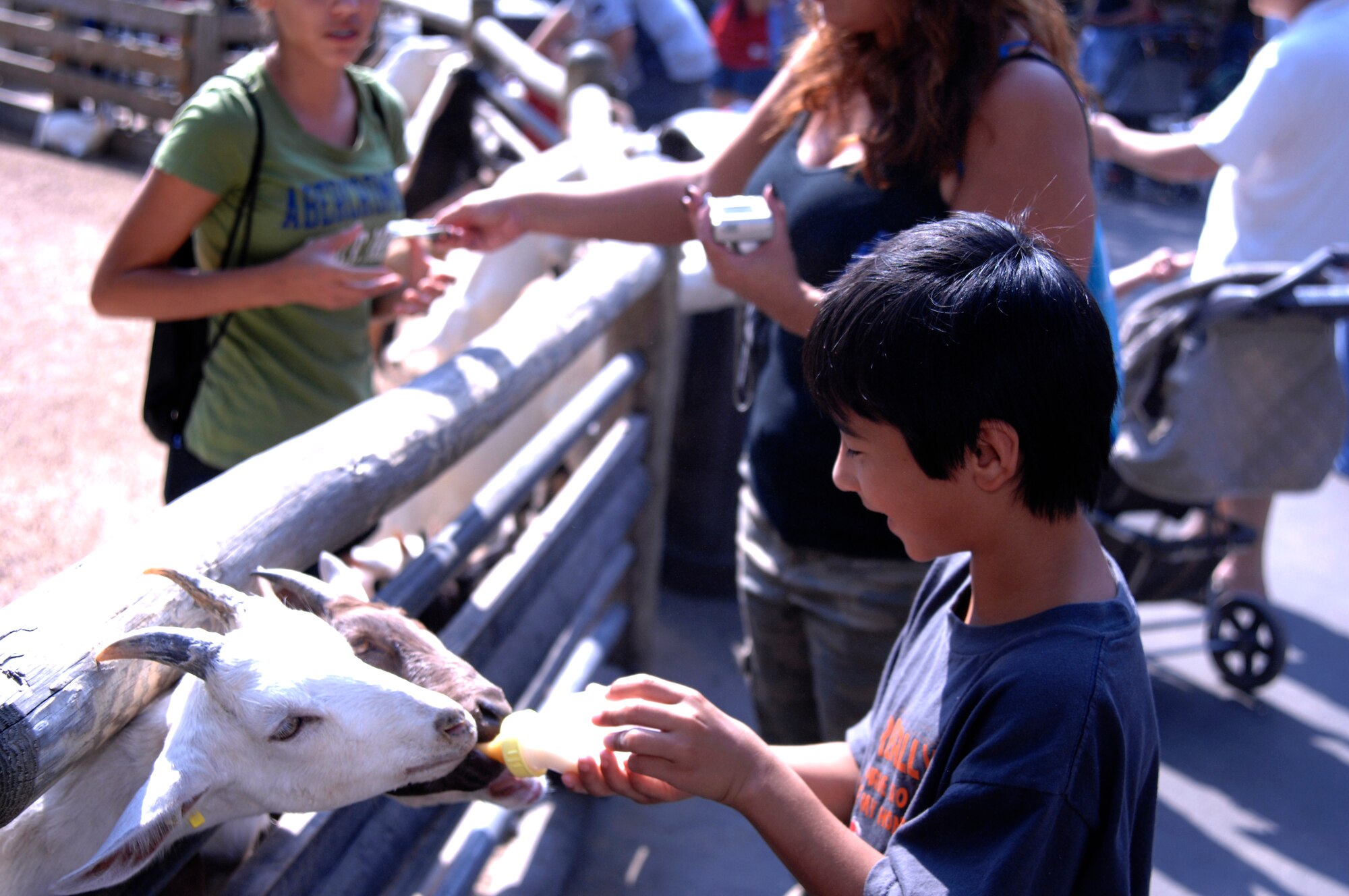 SCOTT AIR FORCE BASE, Ill. -- Kalai Taira, son of Tech. Sgt. Ryan Taira, feeds pygmy goats at Grant's Farm in St. Louis, Mo., Saturday. Kalai was there along with more than 50 other members from Team Scott to see elephants, llamas, deer and about 20 other different animals through the Hearts Apart program. 

(U.S. Air Force photo/Airman 1st Class Amber Kelly-Herard) 