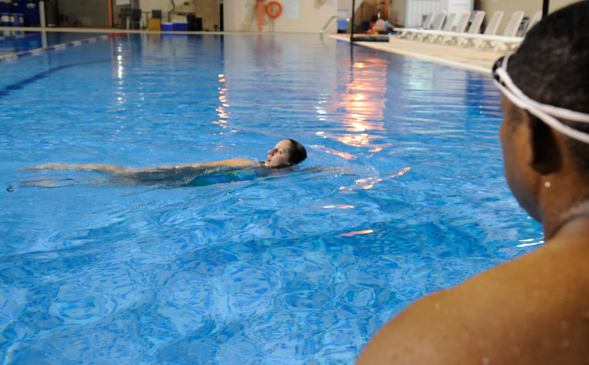 SOUTHWEST ASIA - Tech. Sgt. Micale Fritz, 380th Expeditionary Civil Engineer Squadron, demonstrates a swimming exercise for students Sept. 10. The Missouri native is deployed from Dover Air Force Base, Del. (U.S. Air Force photo/Senior Airman Stephen Linch)