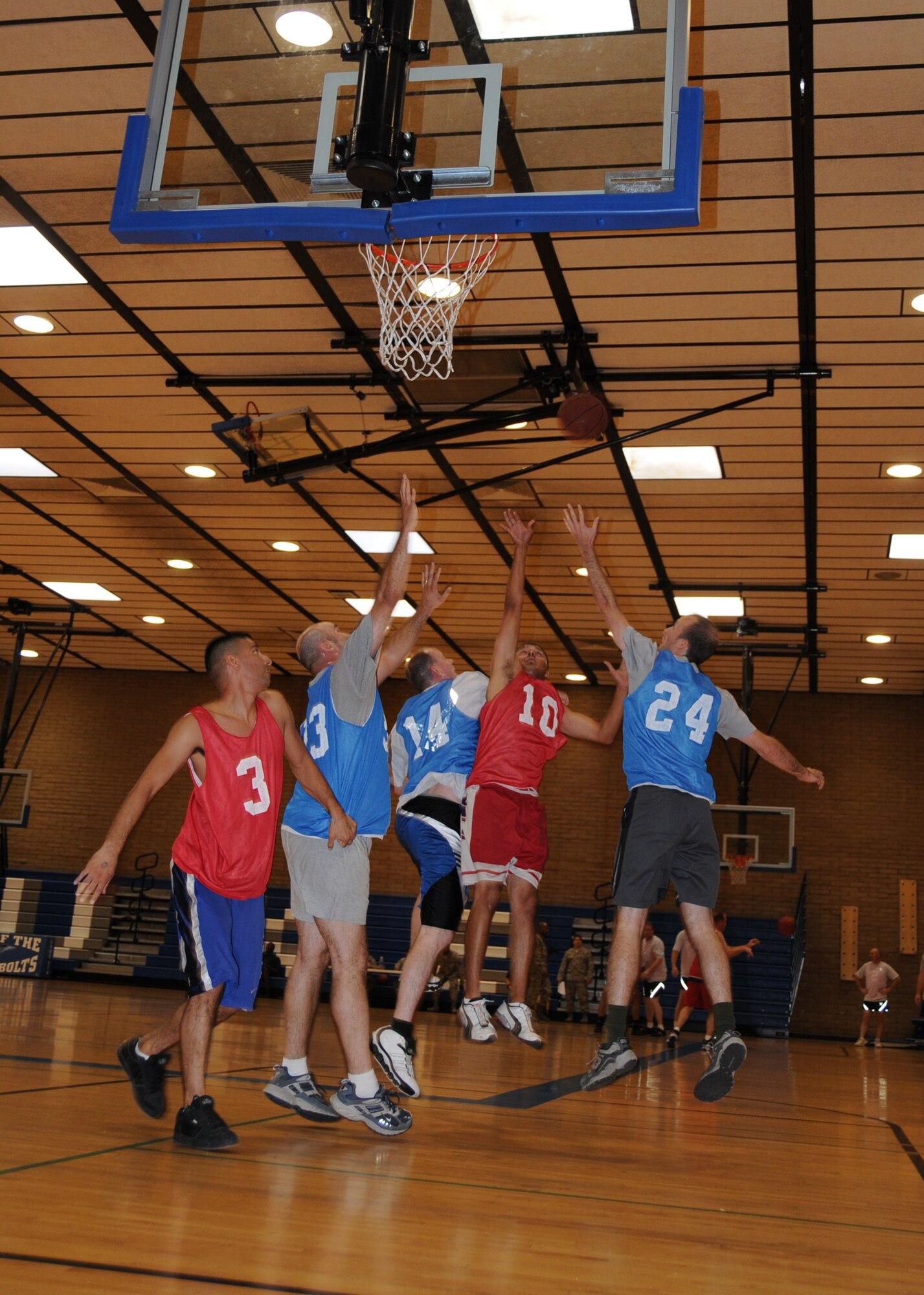 The 944th Communications Flight (in blue) takes on the 944th Logistics Readiness Squadron during a 3-on-3 basketball tournament at the base fitness center Sept. 16. The 944th Services Flight put on a tournament for wing members during the mandatory home station annual tour to encourage fitness and camaraderie. (U.S. Air Force photo/Tech. Sgt. Susan Stout) 