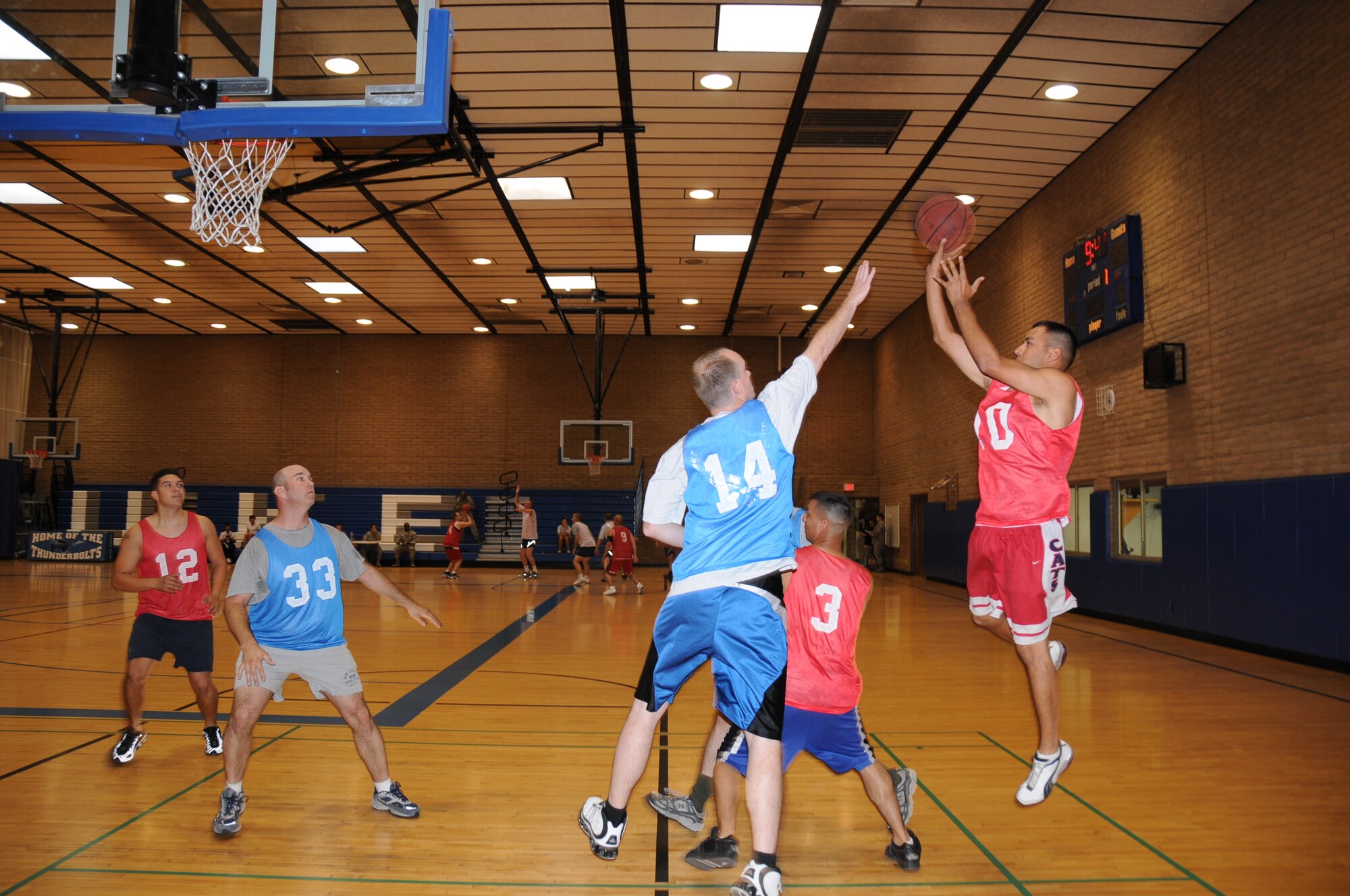 Christopher Saenz, 944th Logistics Readiness Squadron, shoots for a basket during a 3-on-3 basketball tournament against the 944th Communications Flight at the base fitness center Sept. 16. The 944th Services Flight put on a tournament for wing members during the mandatory home station annual tour to encourage fitness and camaraderie. (U.S. Air Force photo/Tech. Sgt. Susan Stout) 