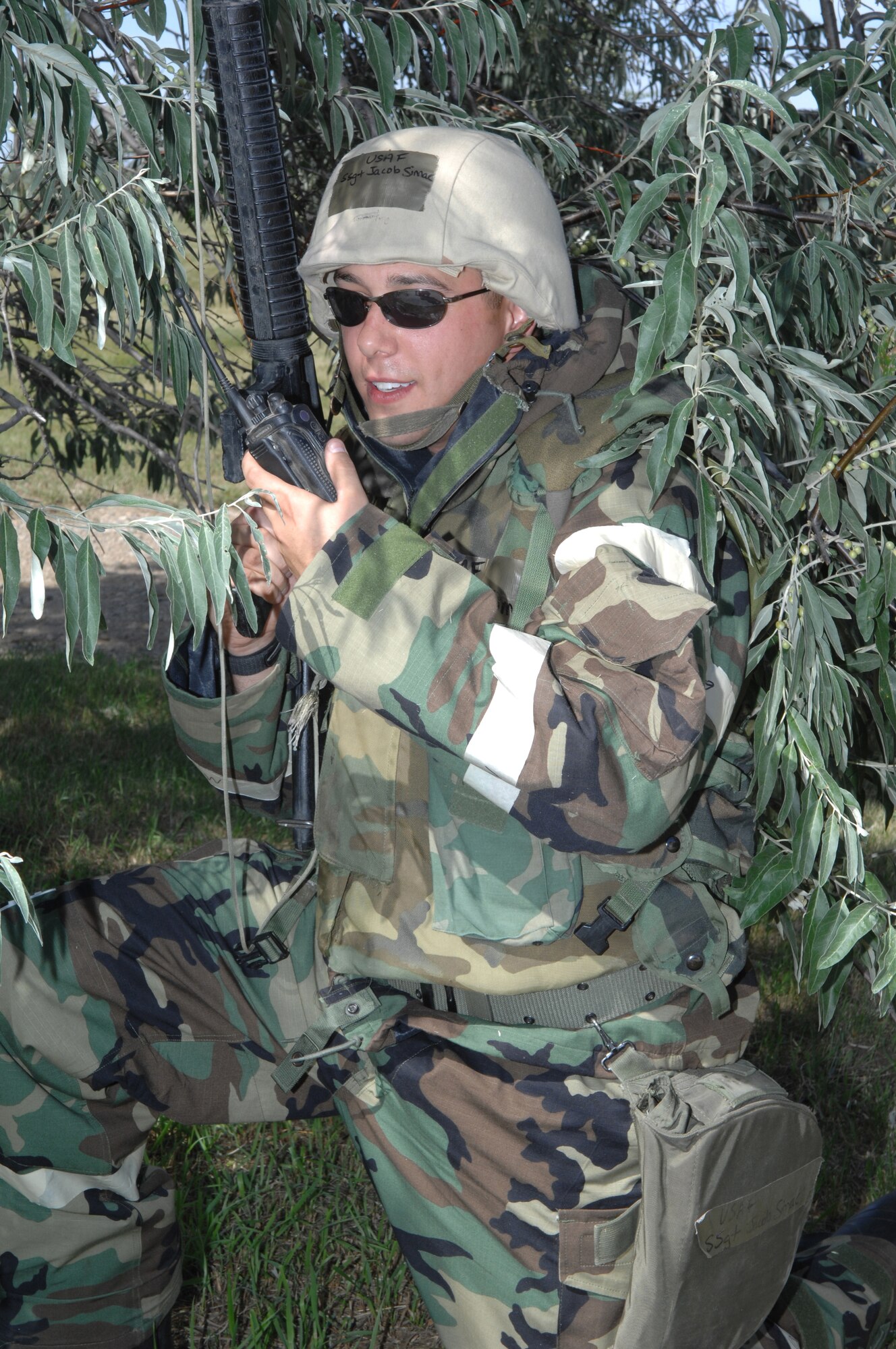 MINOT AIR FORCE BASE, N.D.-- Staff Sgt. Jacob Simac, 5th Civil Engineering Squadron keeps a sharp lookout during combat operations Sept. 10. as part of the Prairie Knight exercise Sept. 9 to 10.  Prairie Knight is a phase II exercise designed to demonstrate unit capability to conduct sustained combat and mission support operations under simulated combat conditions. The 24/7 vigilance of security forces Airmen ensures safe and secure operations for Base X. (U.S. Air Force Photo by Staff Sgt. Stacy Moless)