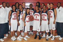 Senior Airman Willamina Folks of the 45th Aeromedical Evacuation Squadron seen here with her teamates from the 2009 Armed Forces Women's Basketball Team (Photo unknown)