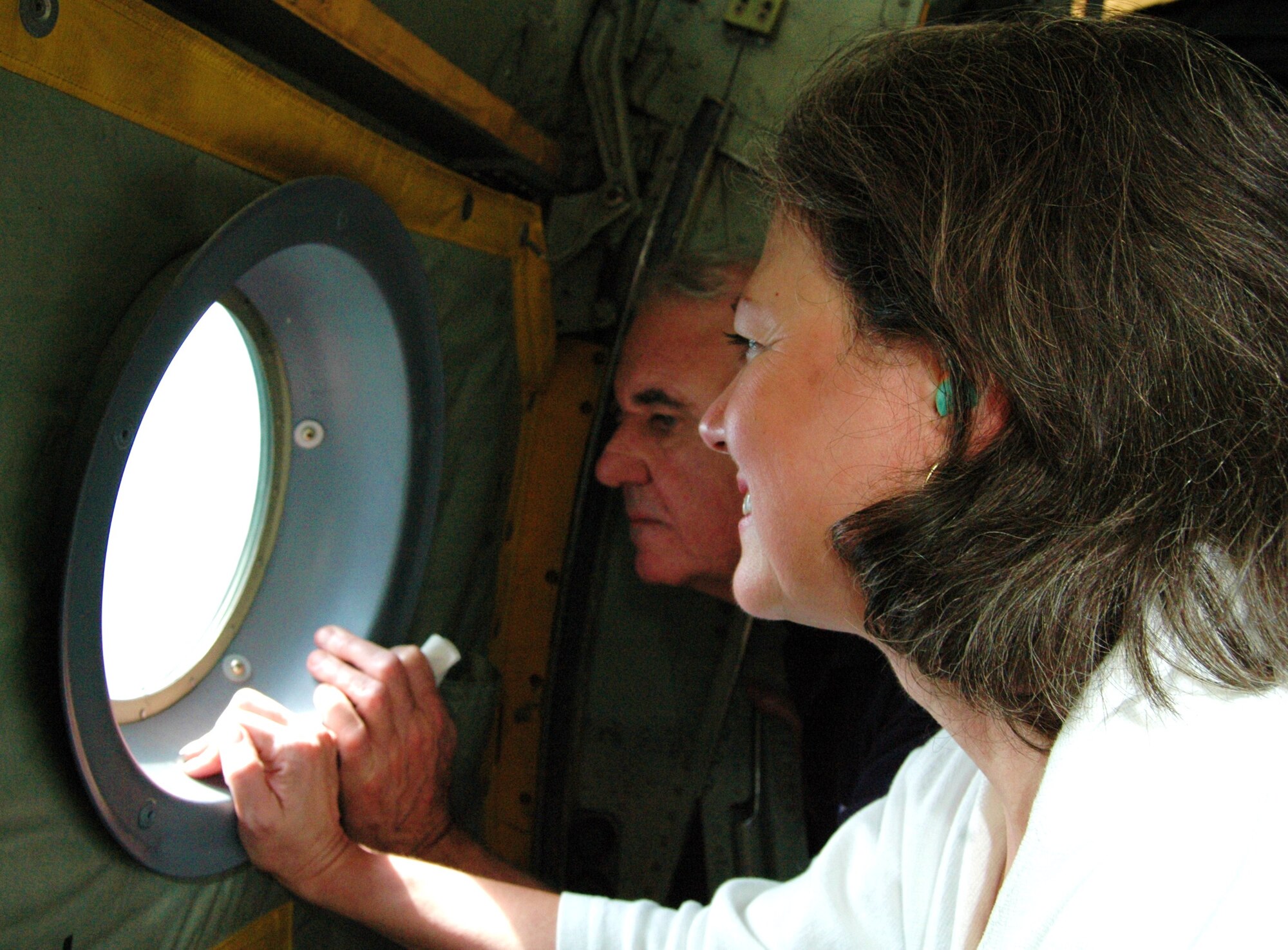 Employers of Reservists at Dobbins Air Reserve Base, Ga., look out the window of a C-130 during an orientation flight in at the annual Employers Day event held here. Over 20 employers attended the event and participated in an orientation given by the 94th Airlift Wing Commander, Col. Nuckolls, and the 22nd Air Force Vice Commander, John Andre, as well as a tour, flight and complimentary lunch. (U.S. Air Force photo/Airman 1st Class Chelsea Gitzen)