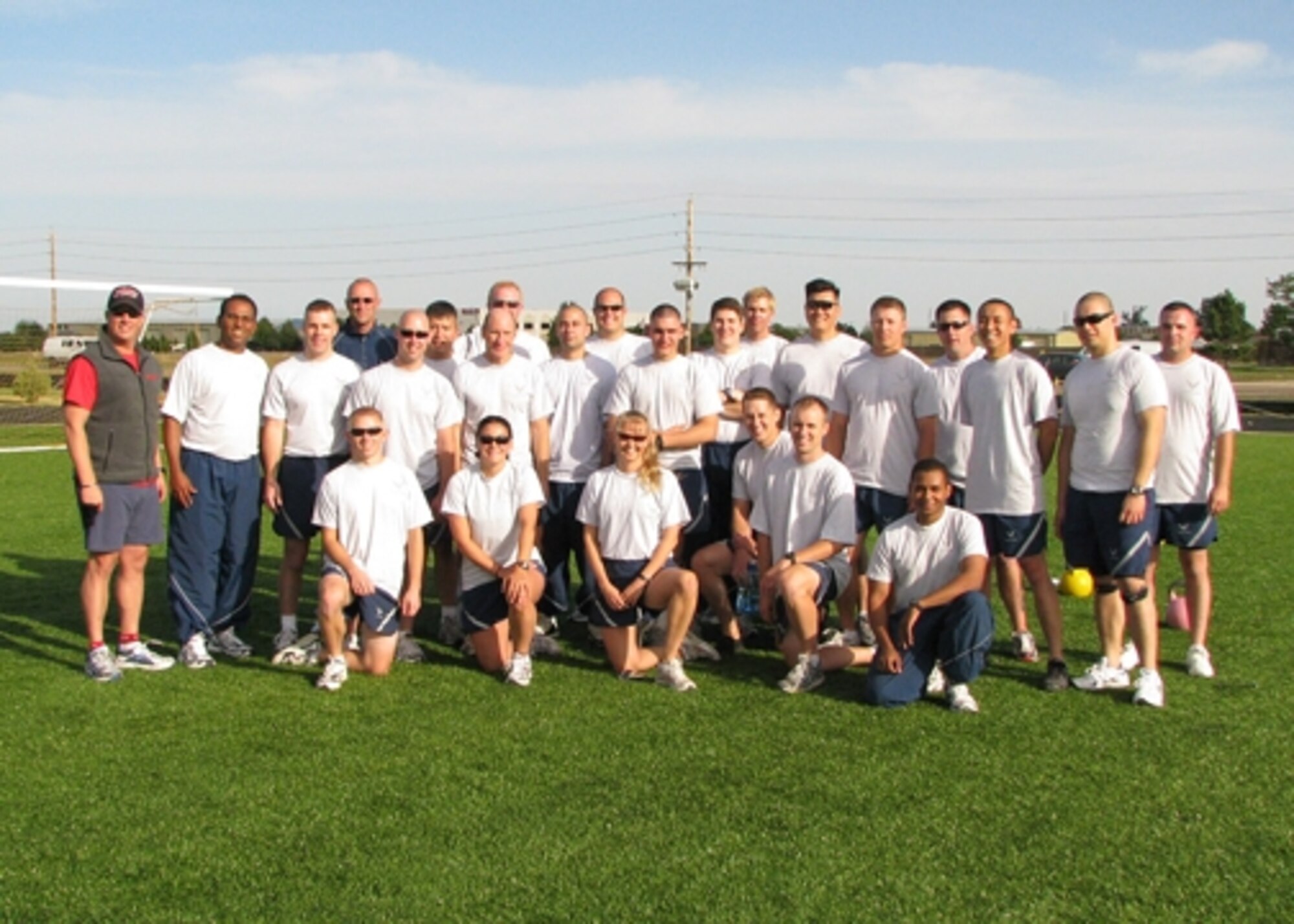 BUCKLEY AIR FORCE BASE, Colo. -- Members of the 2nd Space Warning Squadron pose as a group after taking part in a CrossFit exercise regimen Sept. 11. (U.S. Air Force photo)