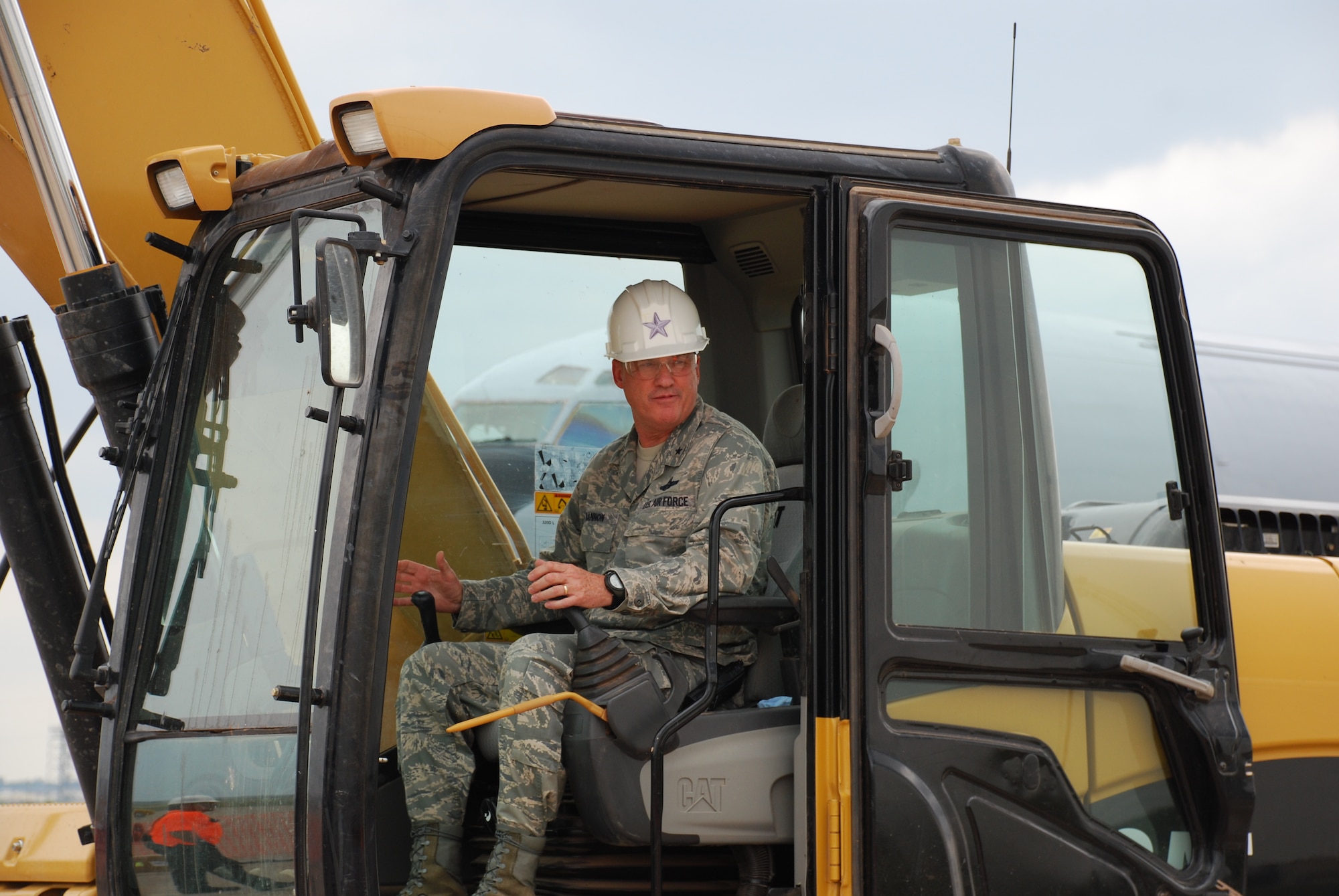 Brig. Gen. O.G. Mannon, 82nd Training Wing commander, operates a caterpillar during the disposal of an F-16 trainer Sept. 16. For two weeks Sheppard will be testing an aircraft disposal method that may be used Air Force-wide. (U.S. Air Force photo/ Airman 1st Class Valerie Hosea)