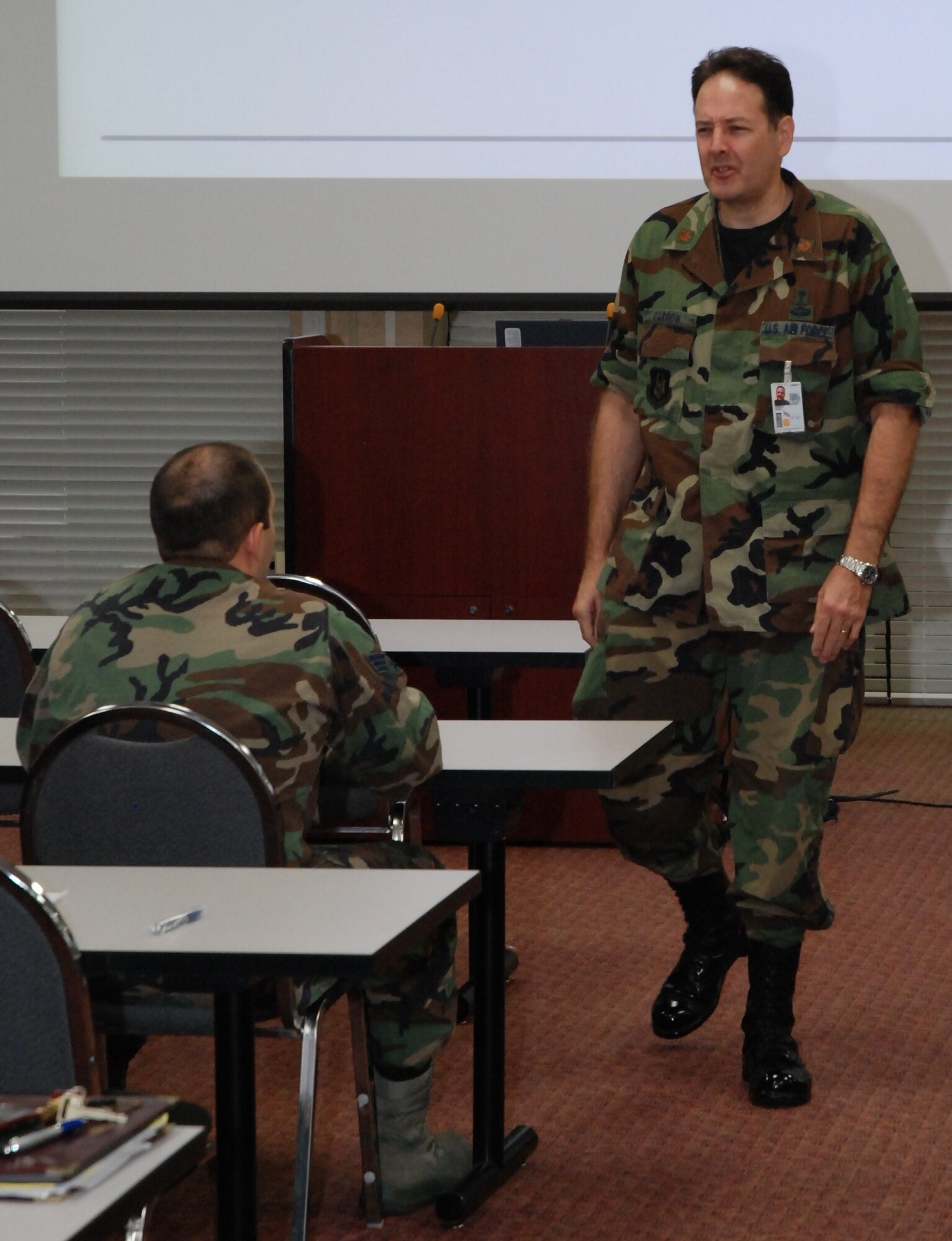 Chaplain Maj. Erwin L. Carrow, chaplain 94th Airlift wing, briefs service members who have recently returned from their respective deployments on services offered to help them transition back to family at the Yellow Ribbon Reintegration Program Sept. 11. (U.S. Air Force photo/Senior Airman Shaun Shenk)