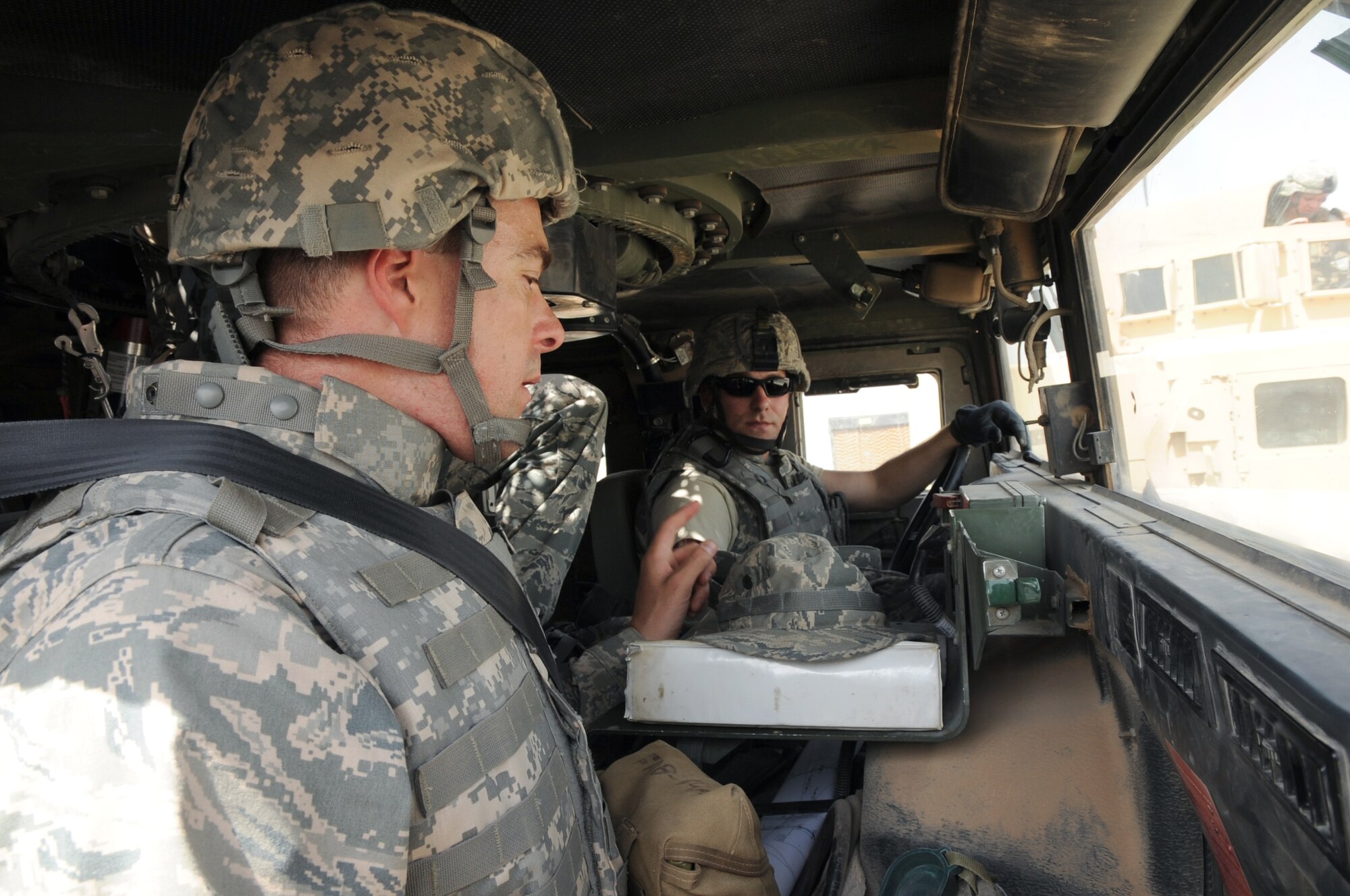 SATHER AIR BASE, Iraq -- Air Force Staff Sgt. Steve Bacon (right), 447th Expeditionary Security Forces Squadron Area Defense Operation Center noncommissioned officer in charge, and Air Force Chaplain (Capt.) Chad Montgomery, 447th Air Expeditionary Group, prepare for a security patrol here Sept. 10, 2009. Chaplain Montgomery has made it his goal to get involved by helping Airmen with their daily missions and training during his deployment. Sergeant Bacon is deployed from Scott Air Force Base, Ill., and is a native of Frankfort, Ill., and Chaplain Montgomery is deployed from Lackland AFB, Texas, and is a native of Newtown Square, Pa. (U.S. Air Force photo/Tech. Sgt. Johnny L. Saldivar)