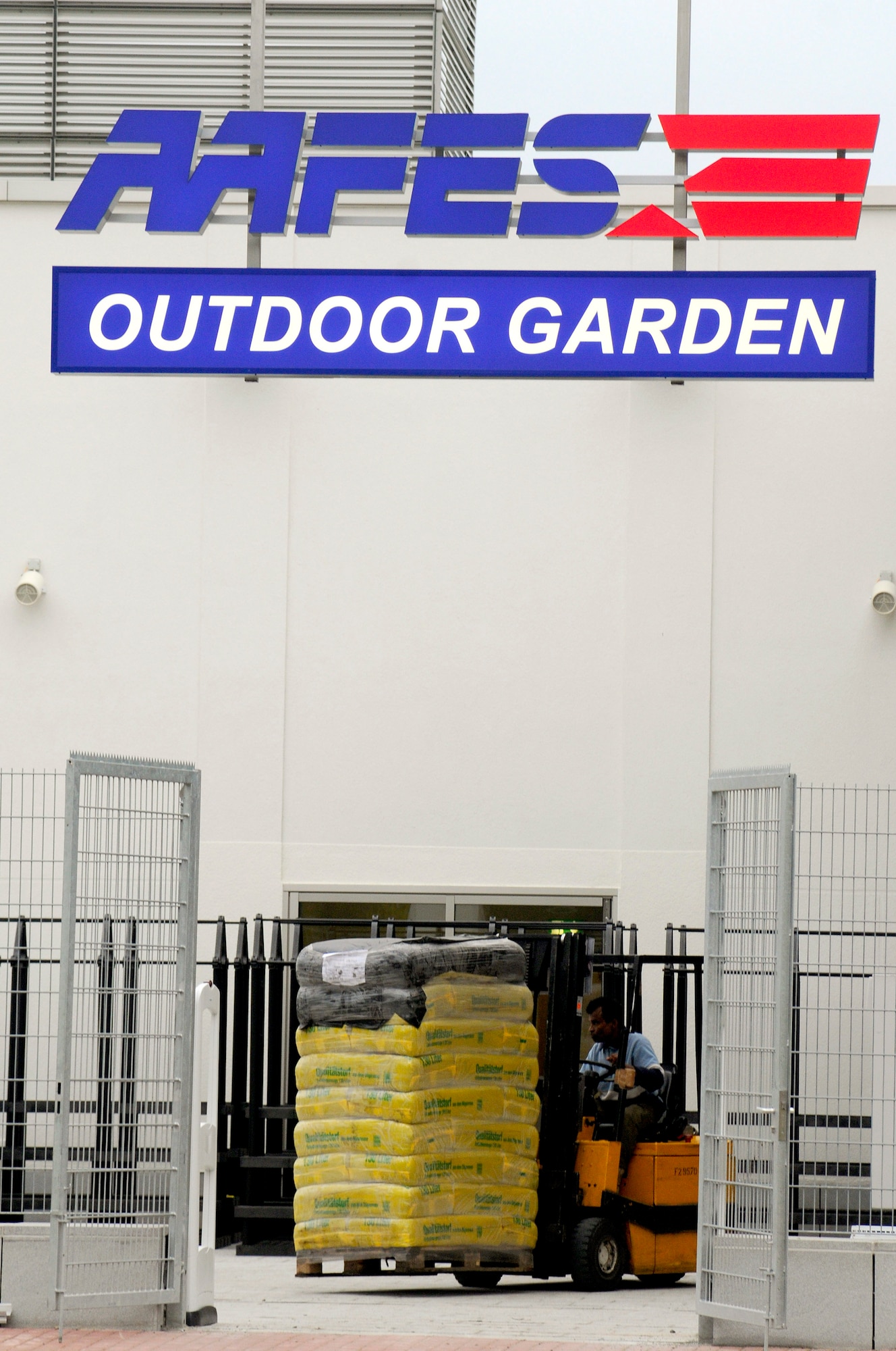 Edwin Varner, Army and Air Force Exchange Service engineering employee, stocks garden supplies in the Outdoor Garden area in preparation for the grand opening of the third and final phase, Ramstein Air Base, Germany, Sept. 17, 2009. The final phase of the KMCC is scheduled to open at 8:55 a.m. Sept. 25, 2009, with a ribbon cutting ceremony.  (U.S. Air Force photo by Tech. Sgt. Kenneth Bellard)