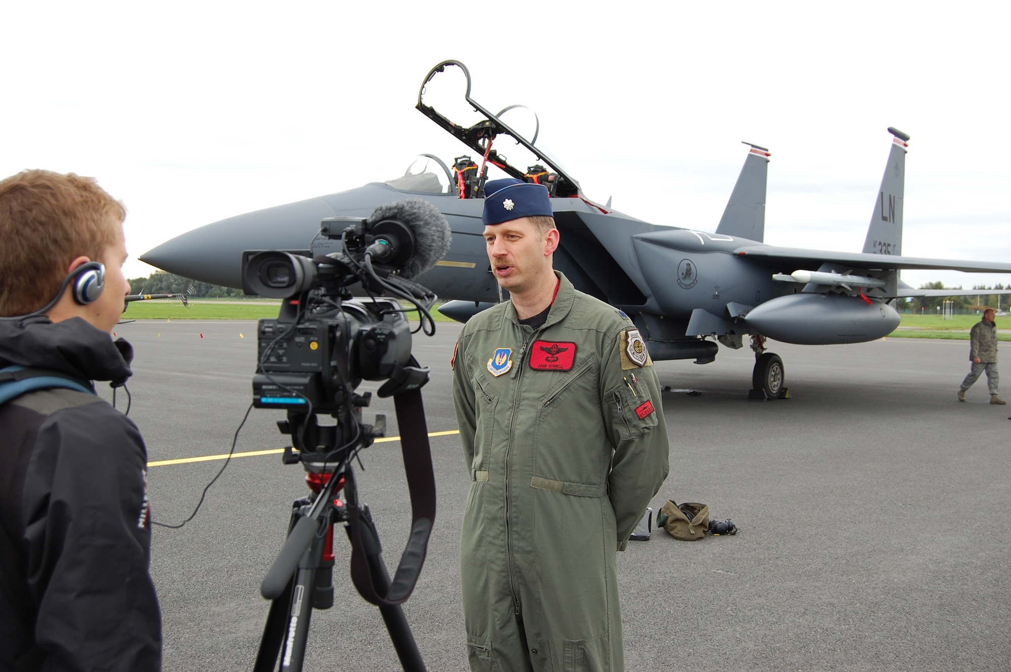 Lt. Col. John “Bugs” Bunnell, 494th Fighter Squadron commander, is interviewed by NATO Television reporter David Heathfield, at the airport in Tallinn, Estonia Monday.  Lieutenant Colonel Bunnell, had just landed his F-15 Strike Eagle after completing day one of NATO’s Baltic Region Training Event IV Alpha. (U.S. Air Force Photo by Master Sgt. Gino Mattorano)