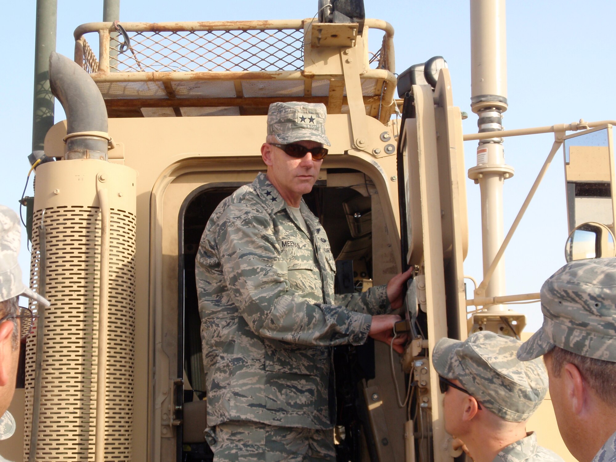 SOUTHWEST ASIA -- Maj. Gen. Brian Meenan, CENTCOM Deployment and Distribution Operations Center director, climbs into an M915 tractor/trailer Sept. 8 during a visit to the 586th Expeditionary Logistics Readiness Squadron?s motor pool. The M915 Line Haul Tractor is used for the rapid, efficient transport of bulk supplies from ocean ports to division support areas within the Iraq Theater of Operations. (U.S. Air Force photo/1st Lt. Rachel Egley)      