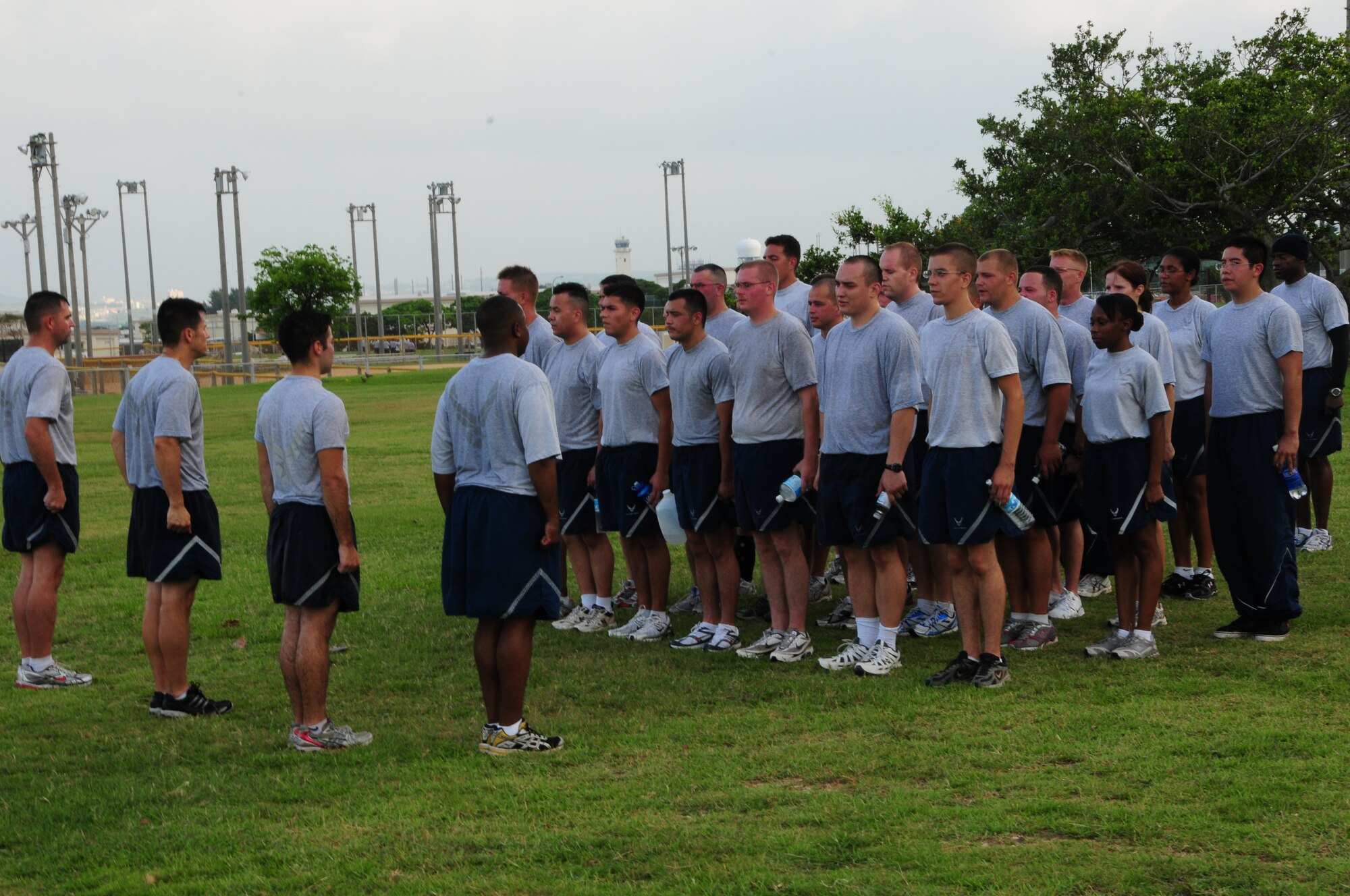 After completing their PT, members of the 18th Logistics Readiness Squadron vehicle maintenance flight stand in formation and recite the Airman's Creed to remind of them of their personal and collective commitments and responsibilities as they begin their day.
(U.S. Air Force photo/Staff Sgt. Lakisha A. Croley)
