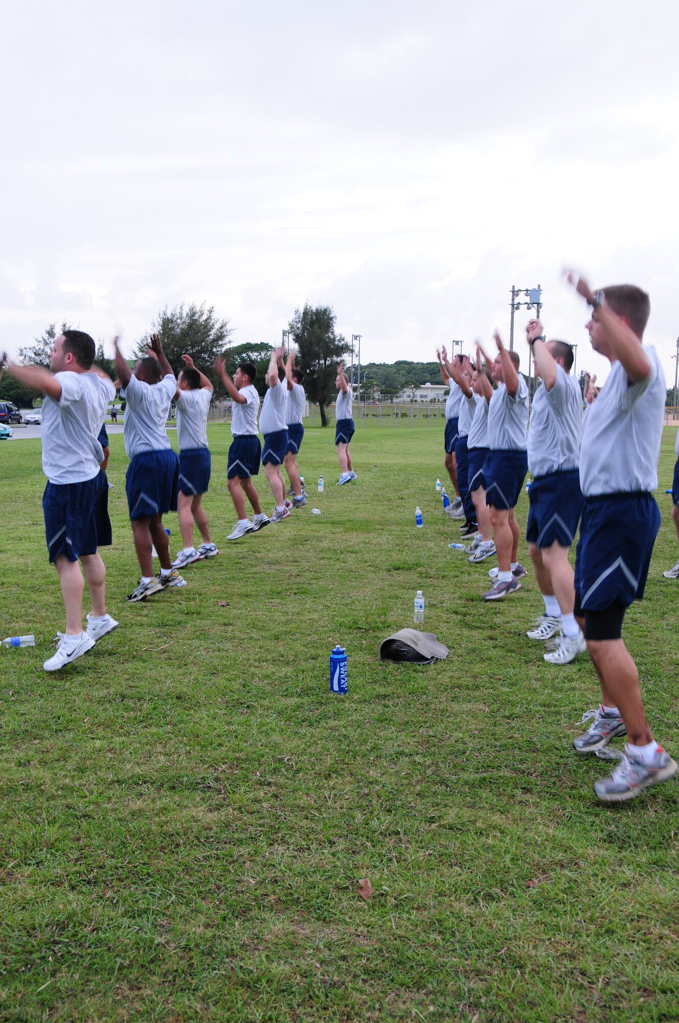Members of the 18th Logistics Readiness Squadron vehicle maintenance flight do calisthenics as part of their weekly PT program. The flight’s PT program isn’t just about exercise: flight members are encouraged to attend the healthy living class offered at the Kadena Health and Wellness Center in order to gain a better understanding of what’s required for a healthy lifestyle. 
 
(U.S. Air Force photo/Staff Sgt. Lakisha A. Croley)
