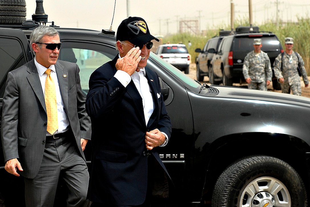 Vice President Joe Biden renders a salute to U.S. Army commanders waiting to greet him outside the Pegasus Dining Facility on Camp Liberty in Baghdad, Sept. 17, 2009.