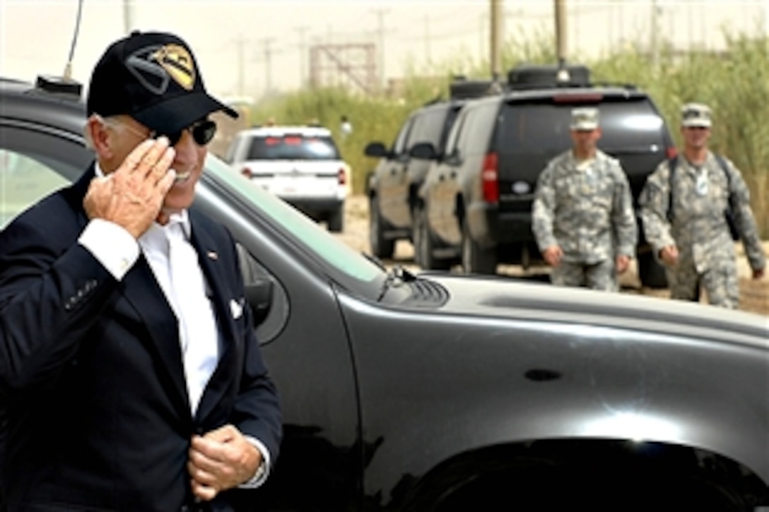 Vice President Joe Biden salutes U.S. Army commanders waiting to greet him outside the Pegasus Dining Facility on Camp Liberty in Baghdad, Sept. 17, 2009.