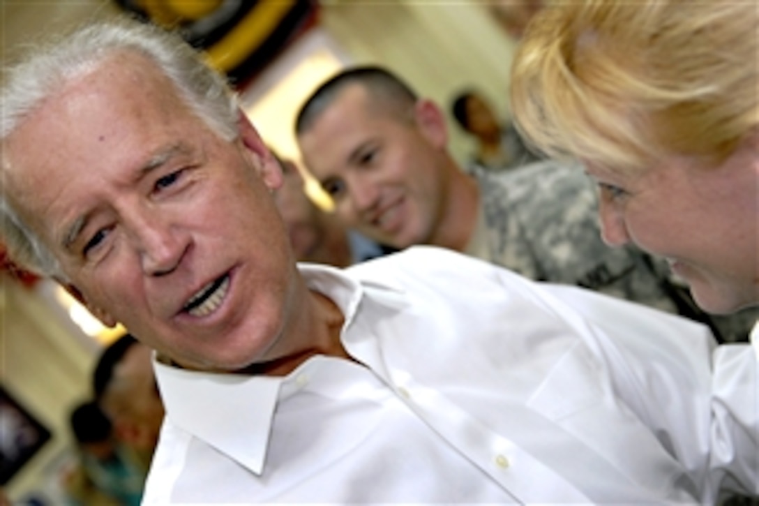 Vice President Joe Biden takes time to visit with soldiers, airmen, sailors and Marines during an unscheduled visit to the Pegasus Dining Facility on Camp Liberty in Baghdad, Sept. 17, 2009.