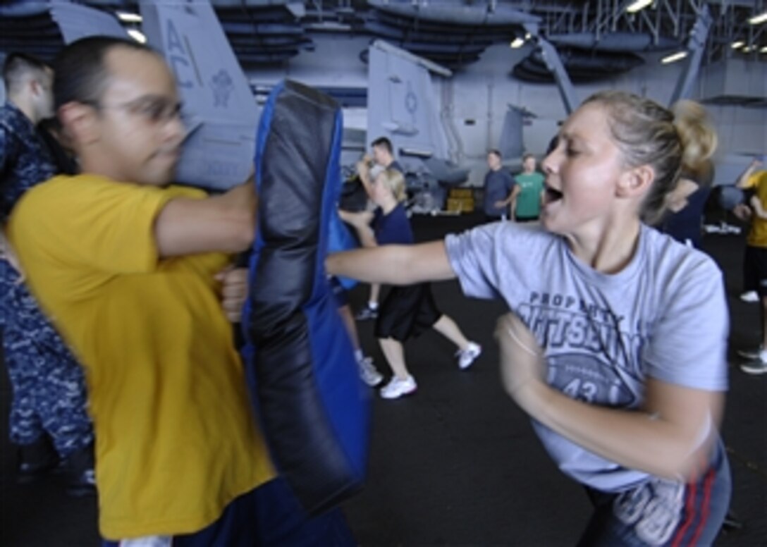 U.S. Navy Petty Officer 3rd Class Laurie Kaczmarik, from the engineering department of the aircraft carrier USS Harry S. Truman (CVN 75), participates in a shipboard reactionary force basic course while underway in the Atlantic Ocean on Sept. 16, 2009.  Kaczmarik is participating in the course after being temporarily assigned to the ship’s in-port security force.  The Truman is participating in a joint task force exercise designed to test and evaluate the U.S. Navy's reaction to multiple wartime scenarios from small-craft attacks to land-based missile attacks and is the final certification for a strike group preparing to deploy.  