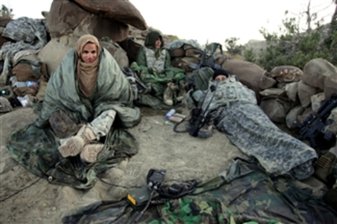 U.S. Army soldiers awake in their hasty fighting position after a night patrol in the mountains near Sar Howza, in Paktika province, Afghanistan, on Sept. 4, 2009.  The soldiers are deployed with Bulldog Troop, 1st Squadron, 40th Cavalry Regiment.  