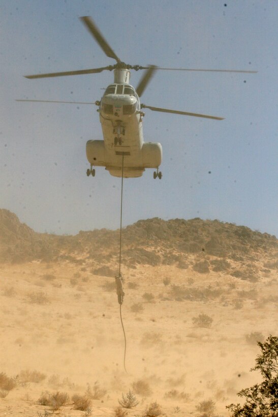A mortarman from 81mm Mortar Platoon, Weapons Company, 2nd Battalion, 7th Marine Regiment, here, fast ropes out of one of Marine Medium Helicopter Squadron 165’s CH-46E “Sea Knight” helicopters at Marine Corps Air Ground Combat Center Twentynine Palms, Calif., Sept. 17. The platoon is training to be the Tactical Recovery of Aircraft and Personnel team during their deployment with the 31st Marine Expeditionary Unit.