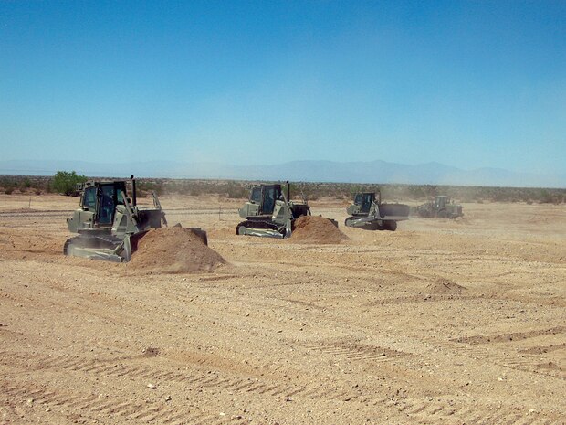 Marine Wing Support Squadron 374 heavy equipment operators remove dirt from and level an unmanned aircraft system runway at the Chocolate Mountain Aerial Gunnery Range in Calif., Sept. 21, 2009. The runway, which was the first built for UASs on the ranges of the Marine Corps Air Station in Yuma, Ariz., will open up new training opportunities for UASs visiting for the Weapons and Tactics Instructor course. Marine Unmanned Aerial Vehicle Squadron 1 will be the first squadron to use the runway during their training in the current WTI.